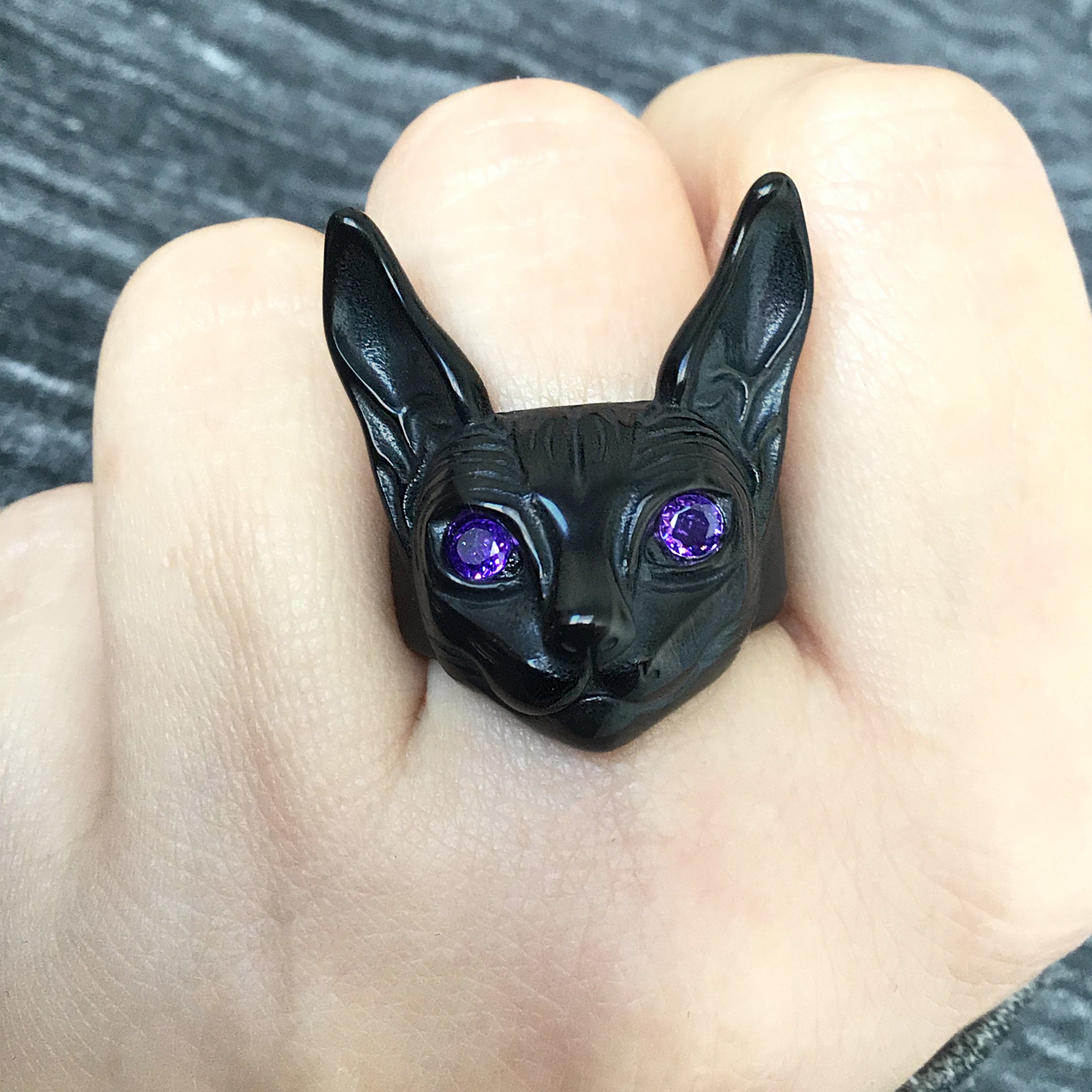 Sphynx cat ring with purcple eyes