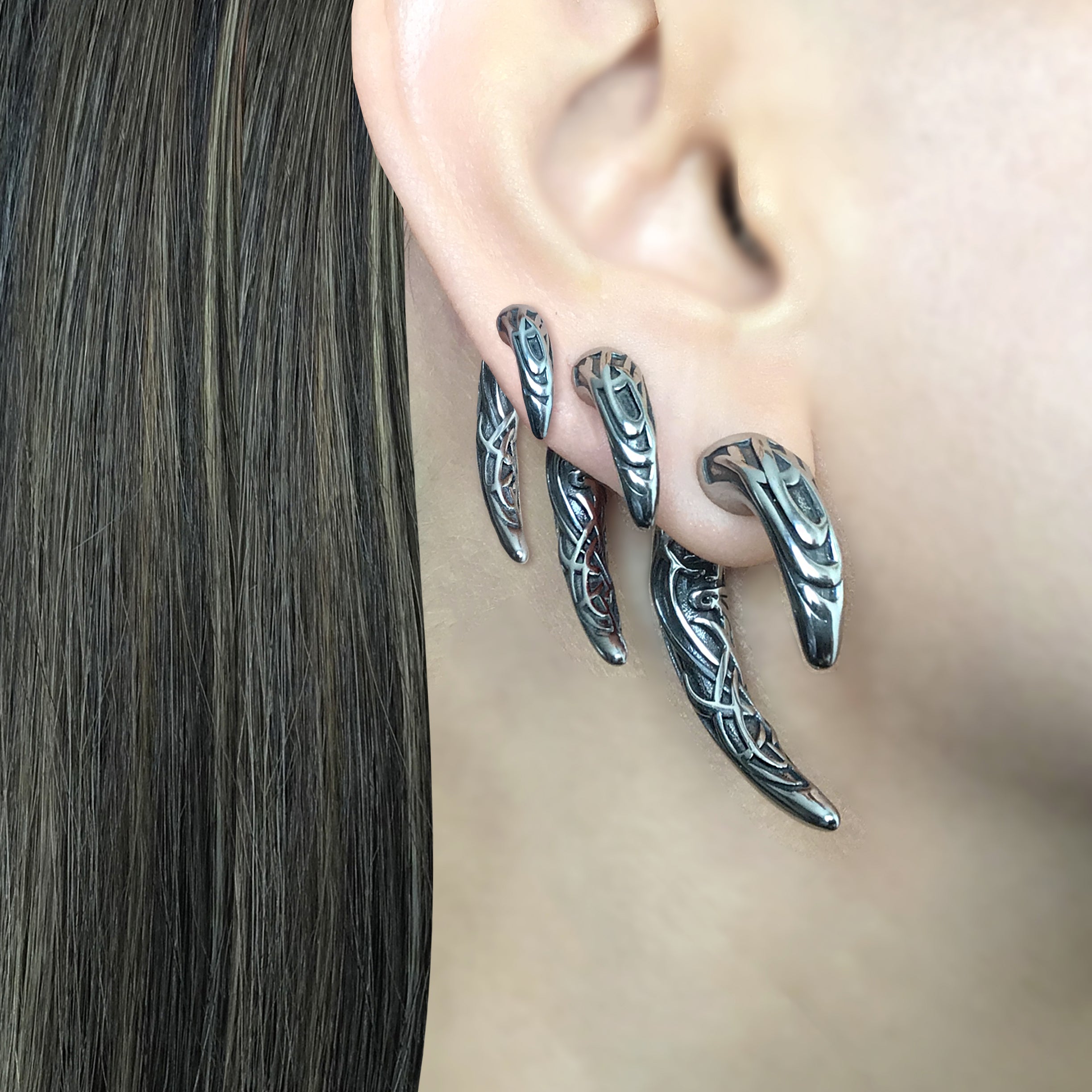 Claw ear jacket with Celtic design