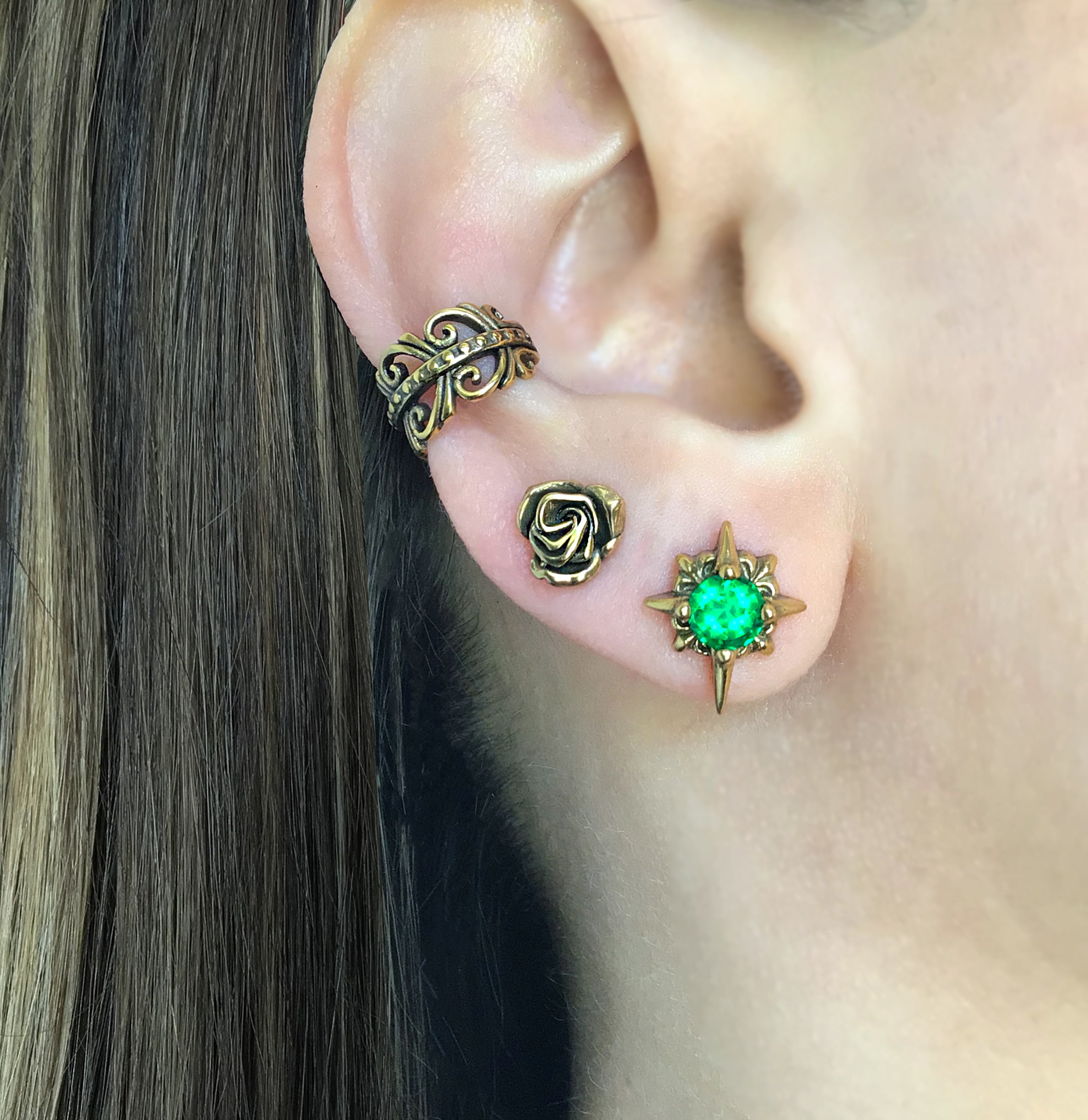 Starburst stud earrings with Green CZ