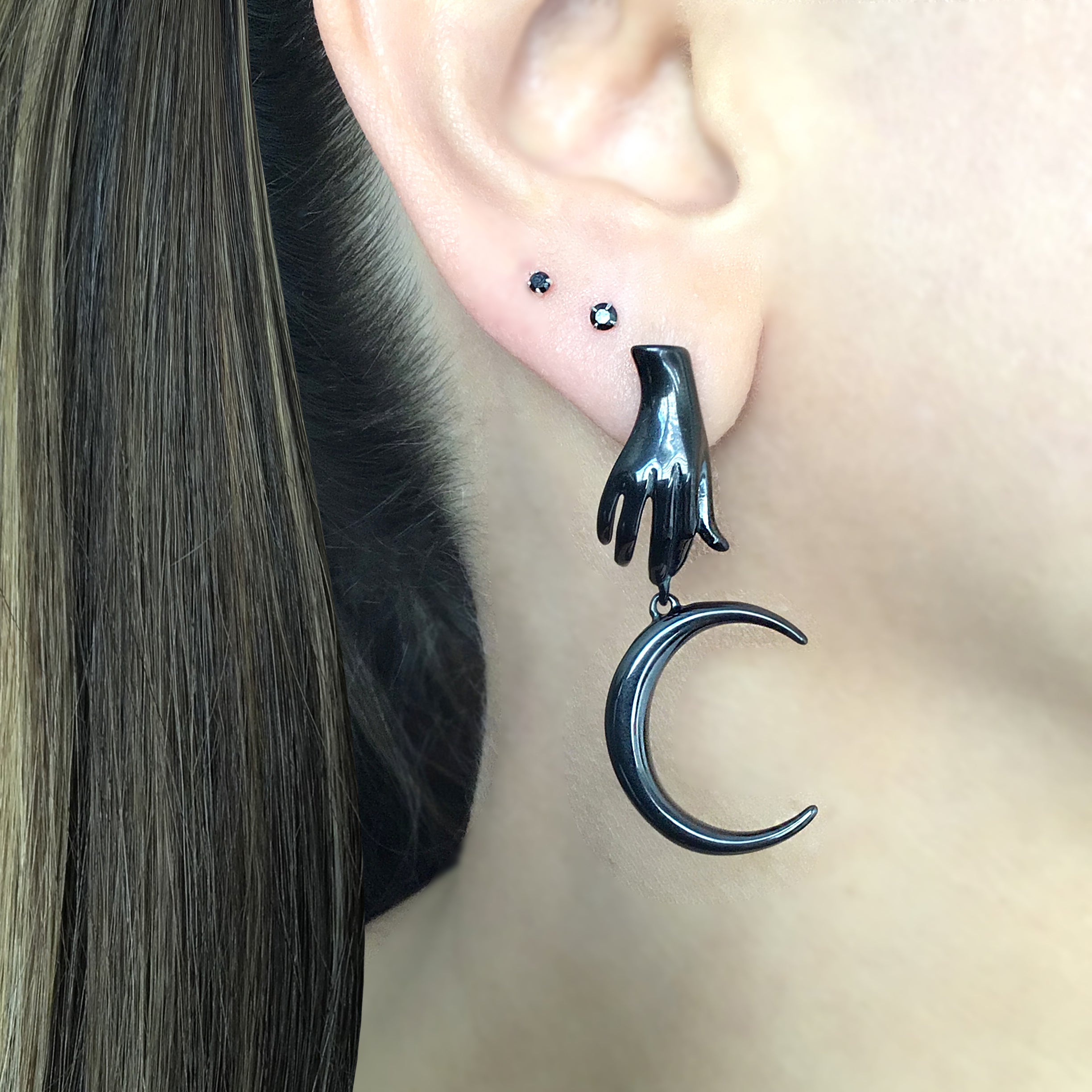Mismatched Hand holding Sun and Moon earrings