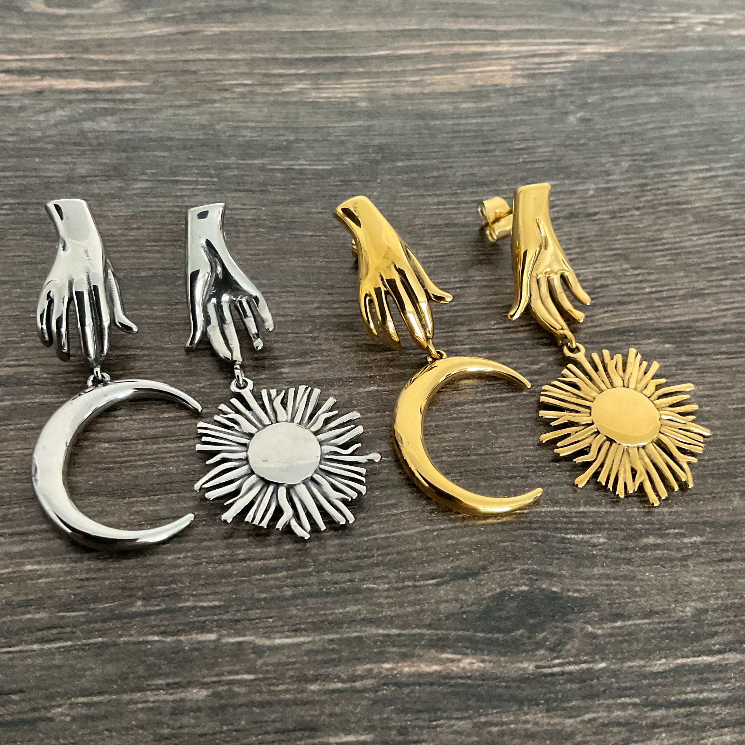 Mismatched Hand holding Sun and Moon earrings