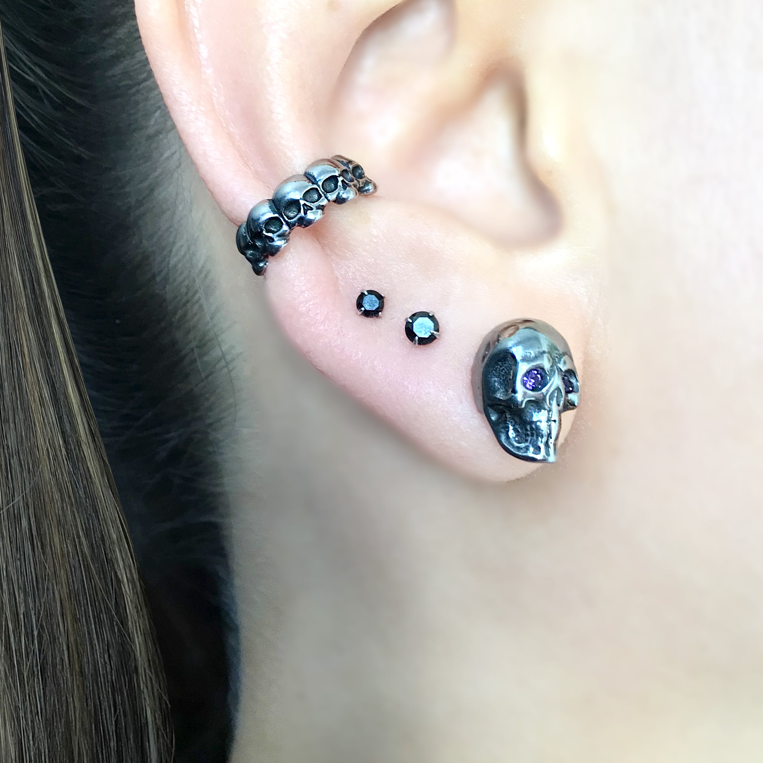 Skull studs with Purple eyes