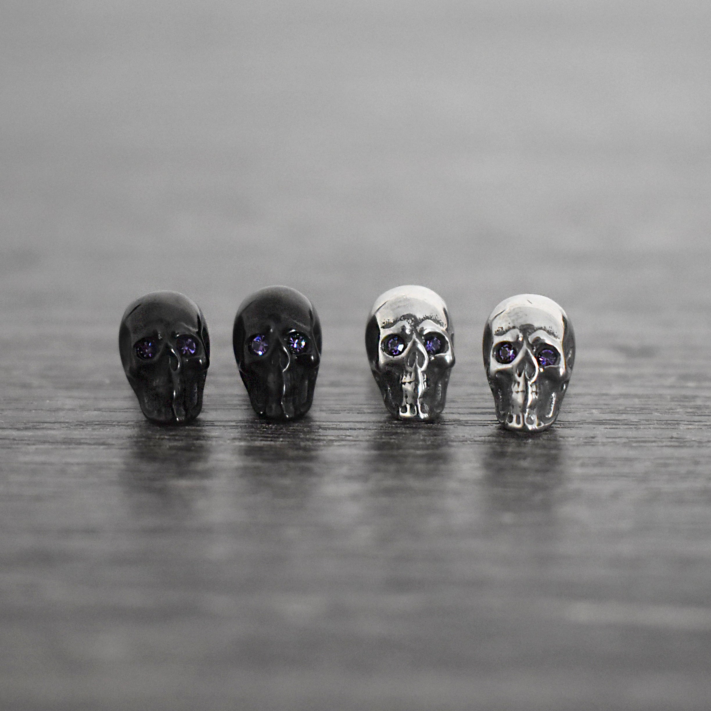 Skull studs with Purple eyes