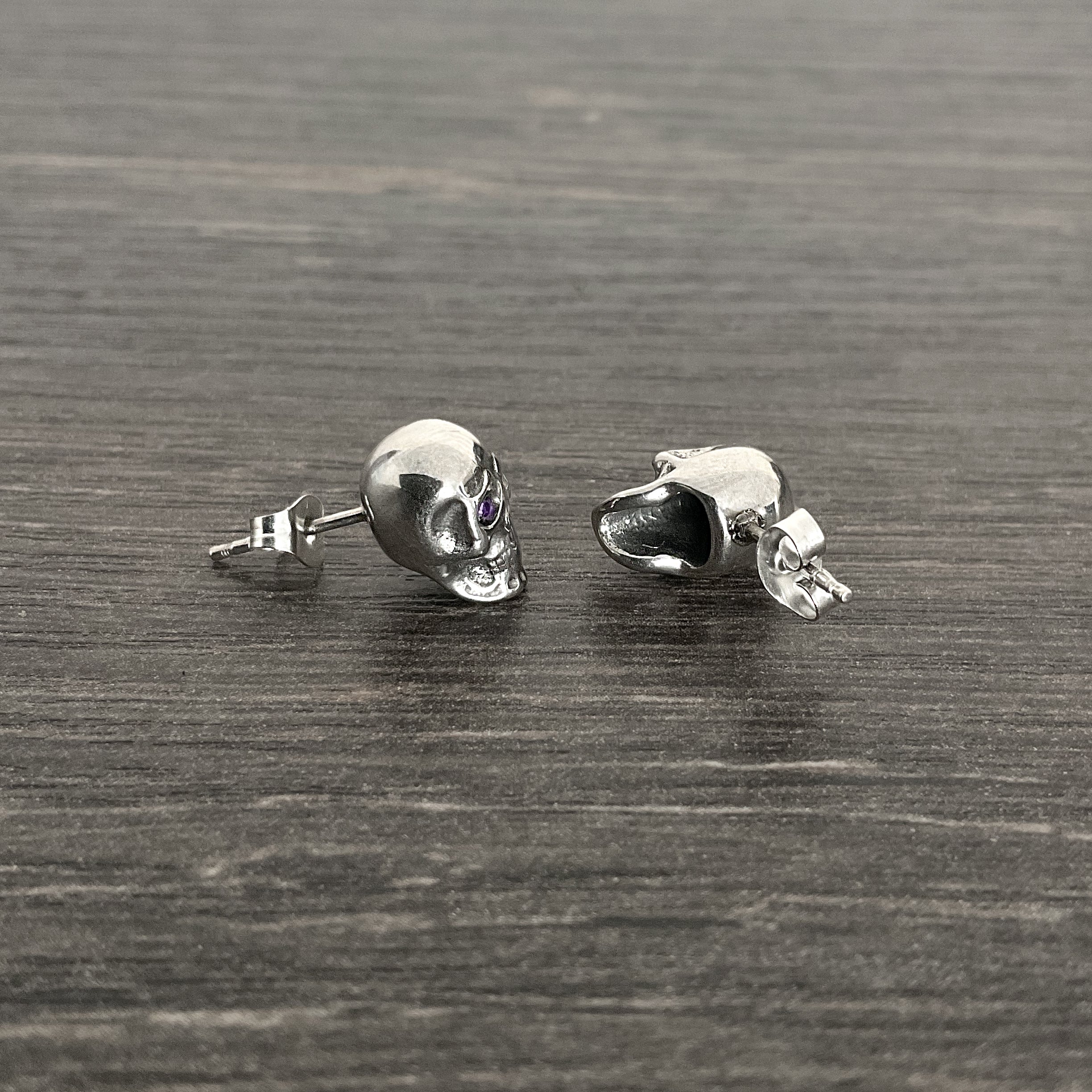 Skull studs with Purple eyes