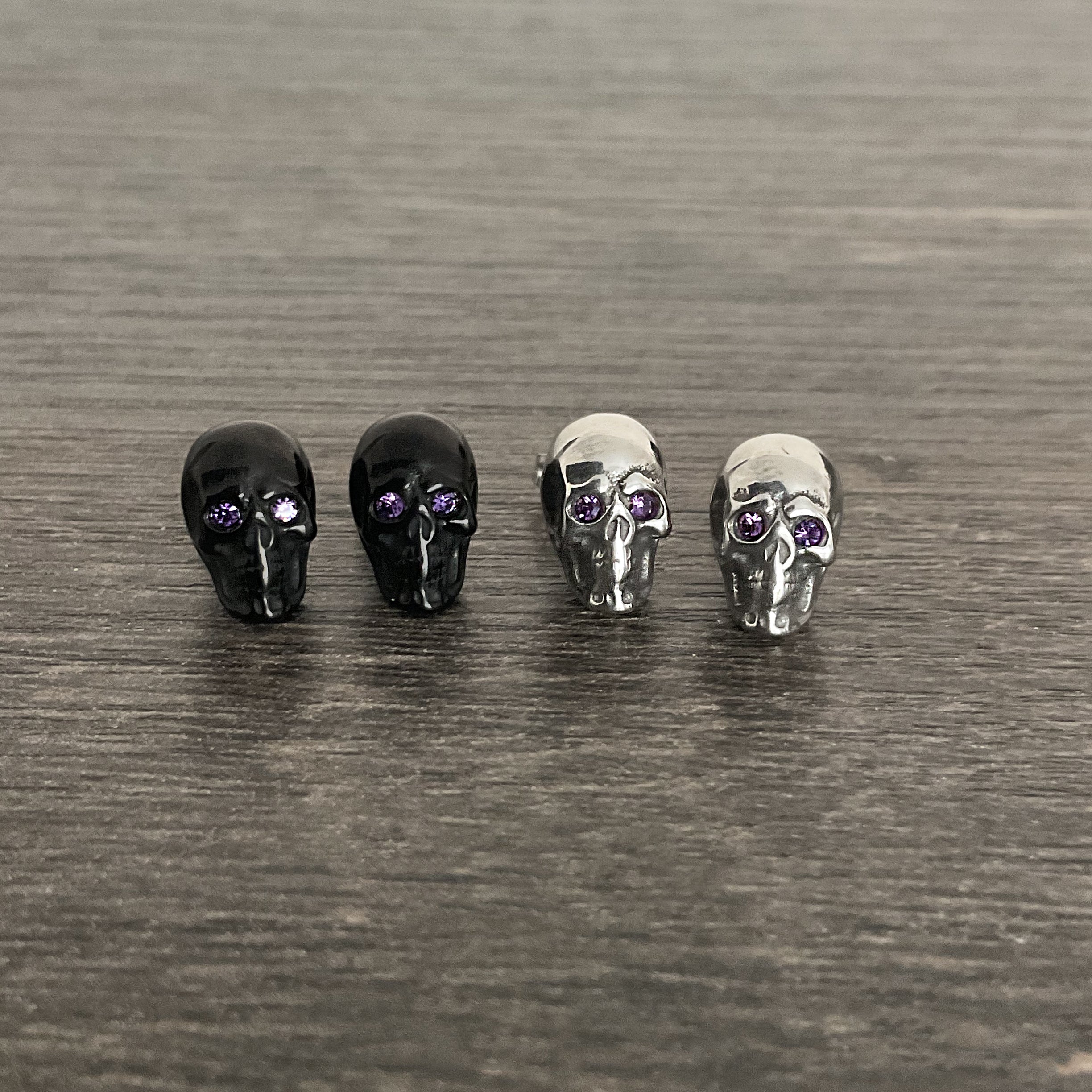Skull studs with Purple eyes