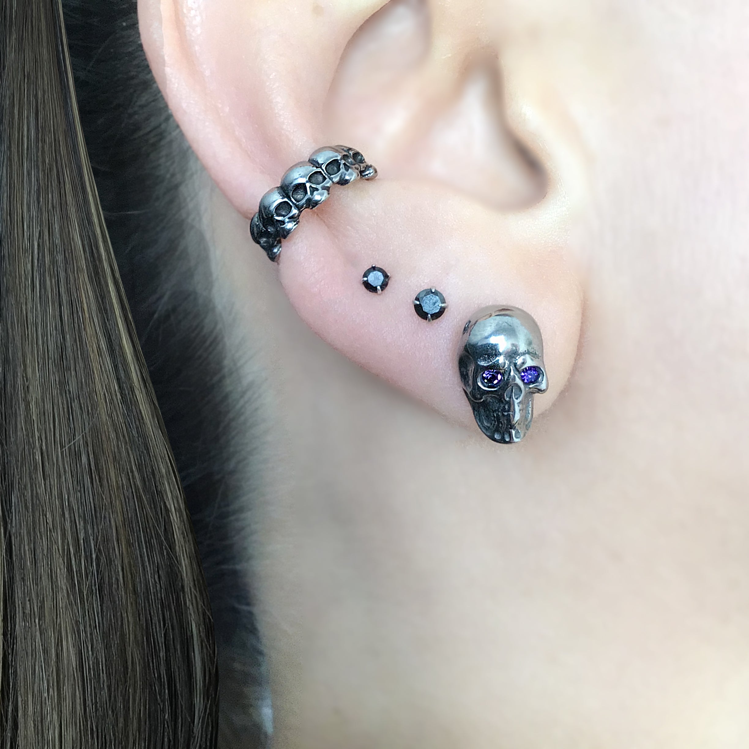 Skull studs with Purple eyes