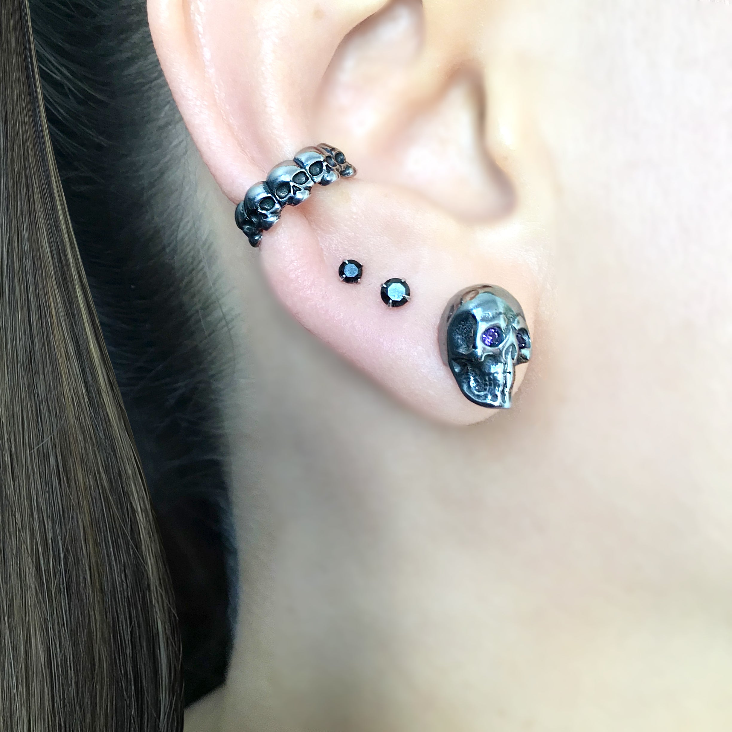 Skull studs with Purple eyes