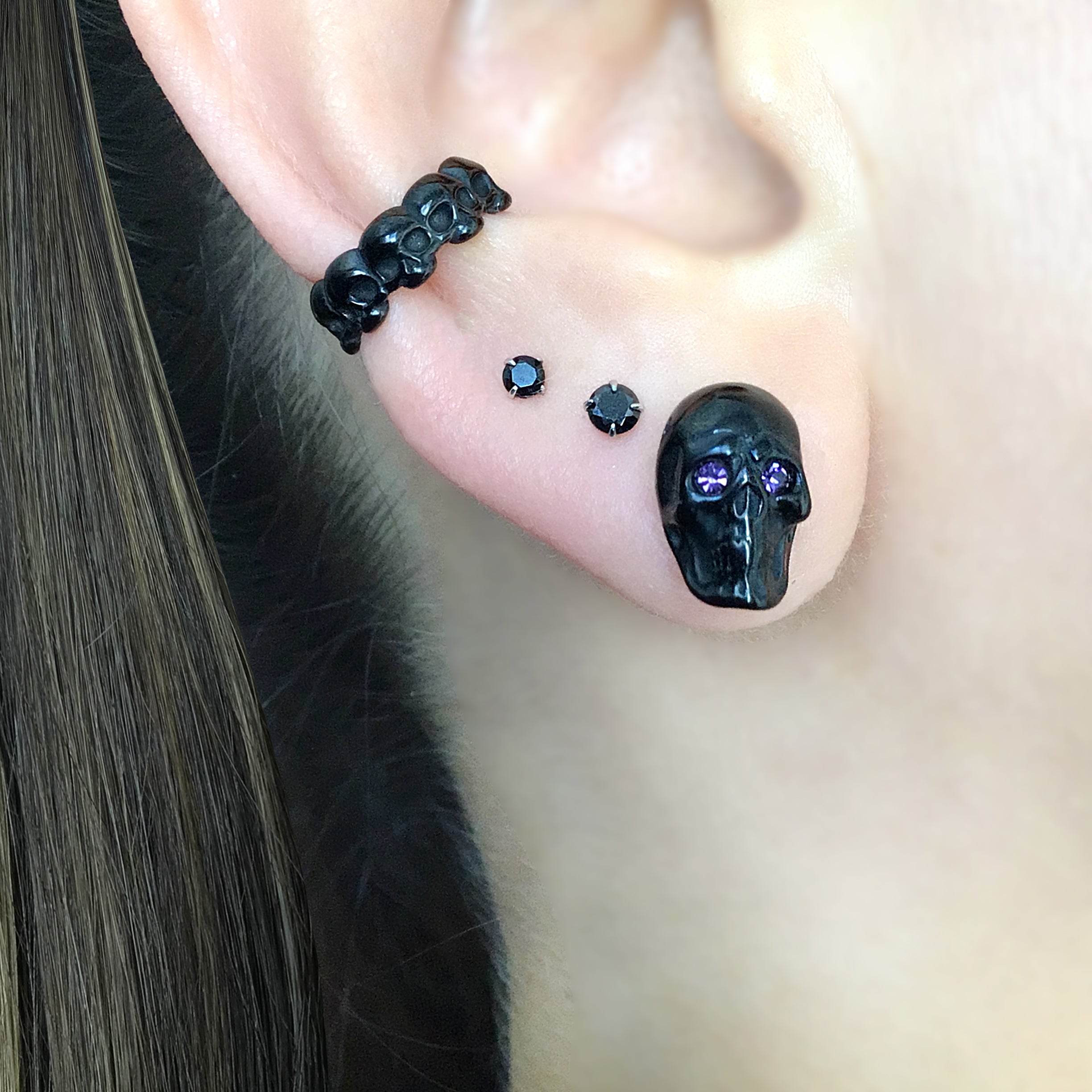 Skull studs with Purple eyes