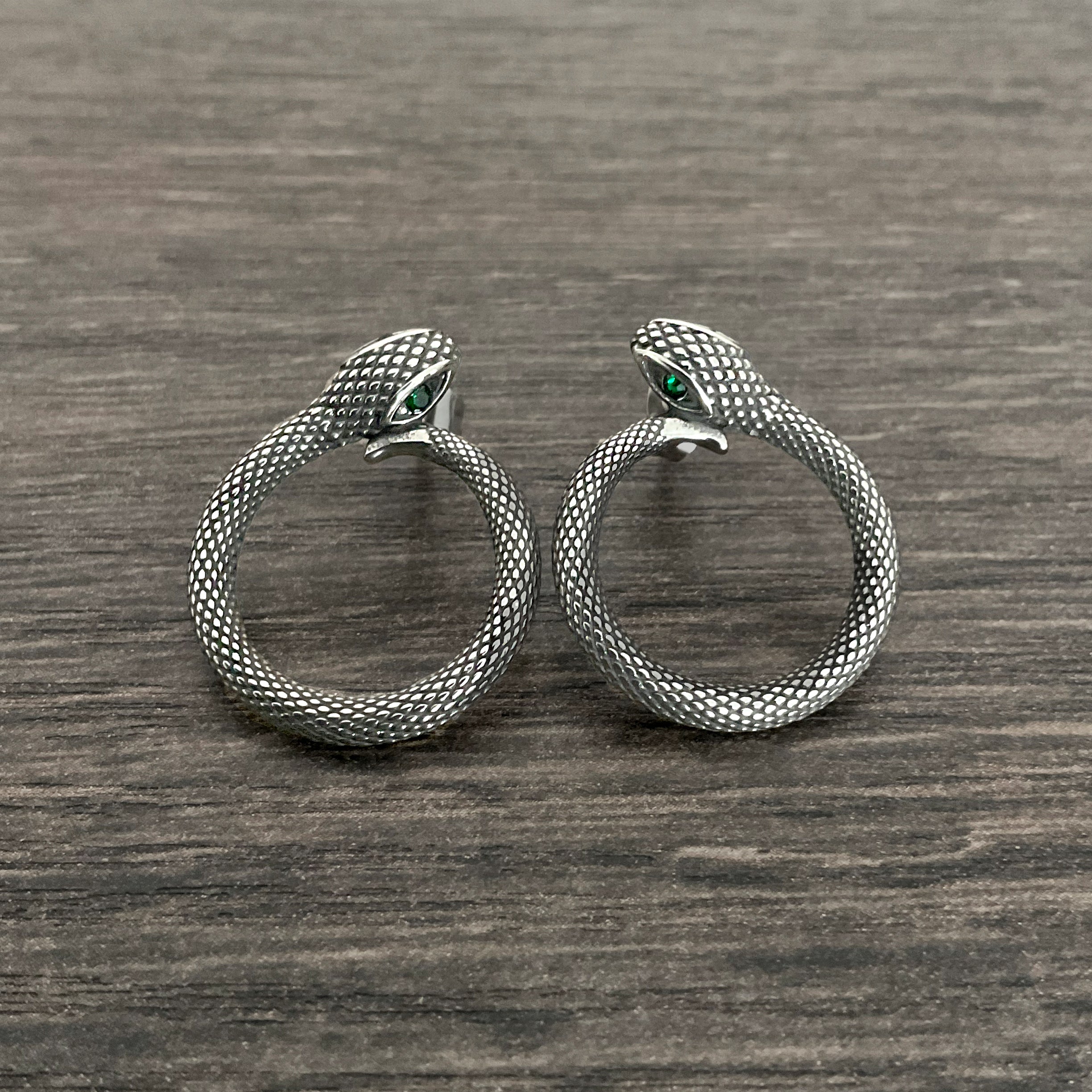 Snake stud earrings with Emerald CZ stones