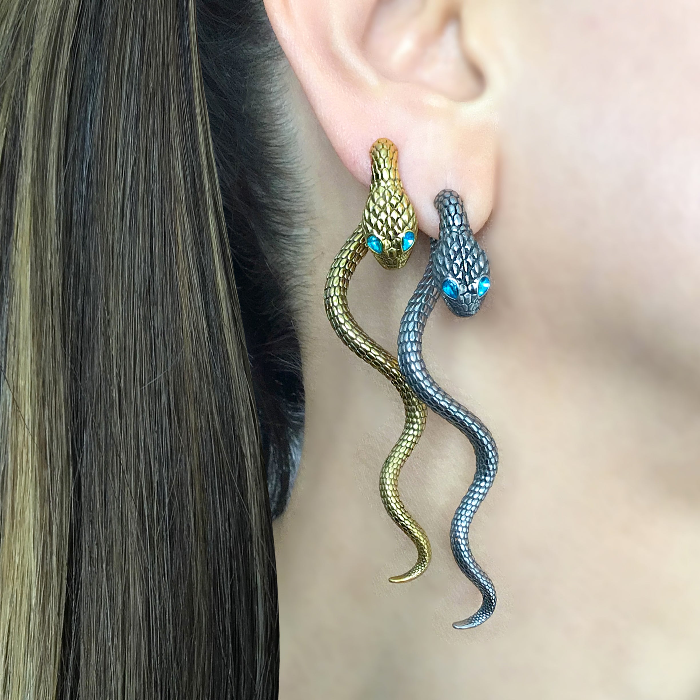 Snake ear jacket with aquamarine eyes