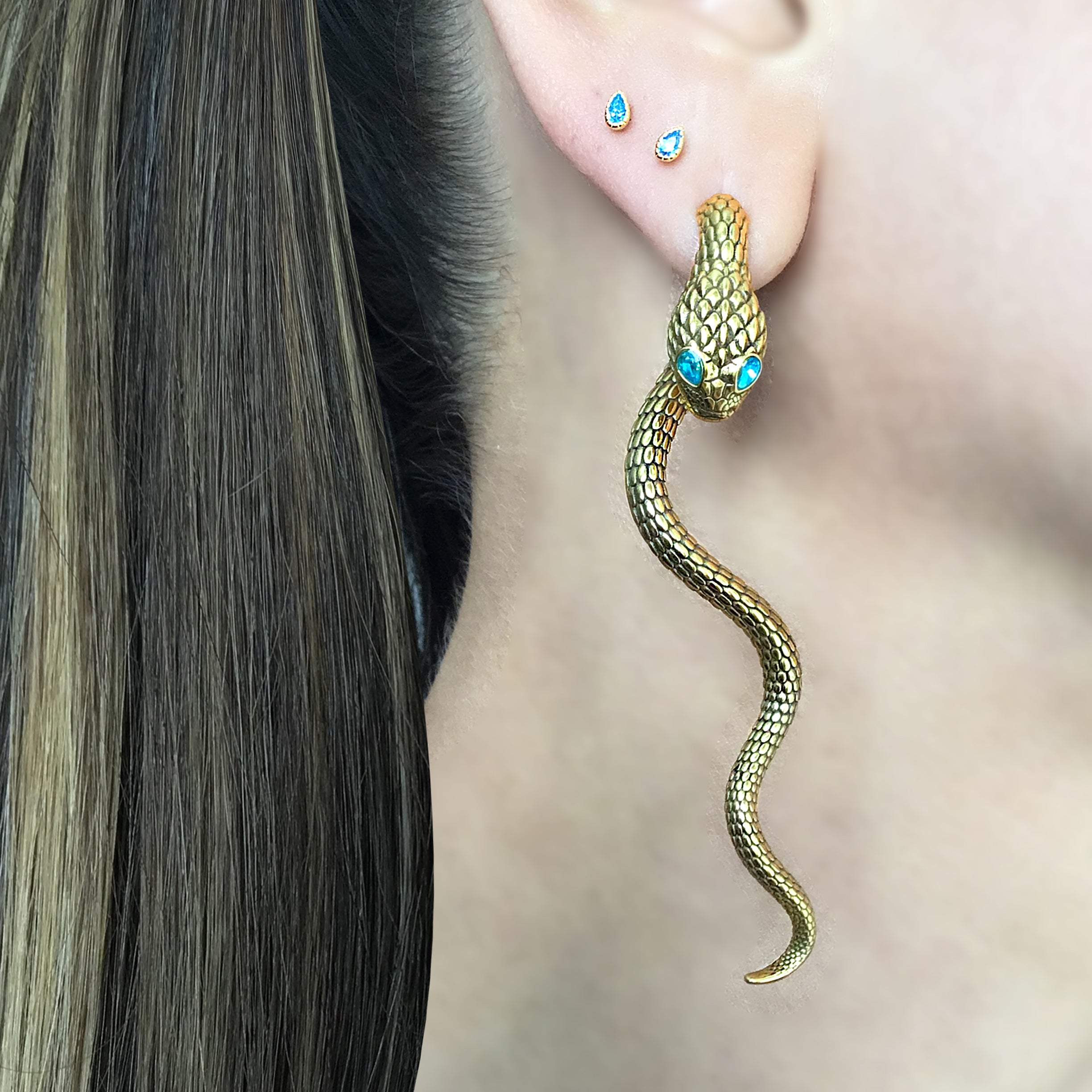 Snake ear jacket with aquamarine eyes