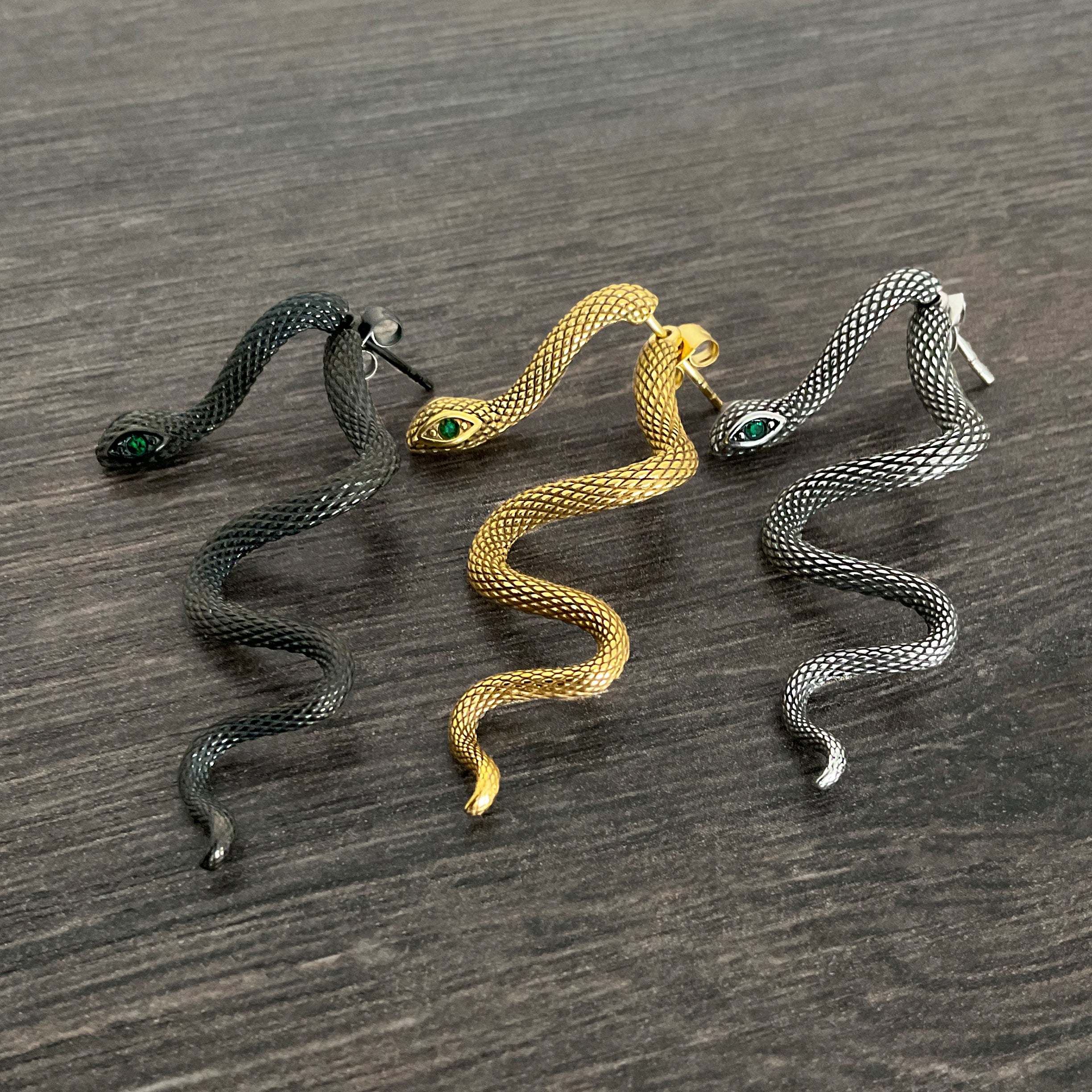 Snake ear jacket with Emerald CZ