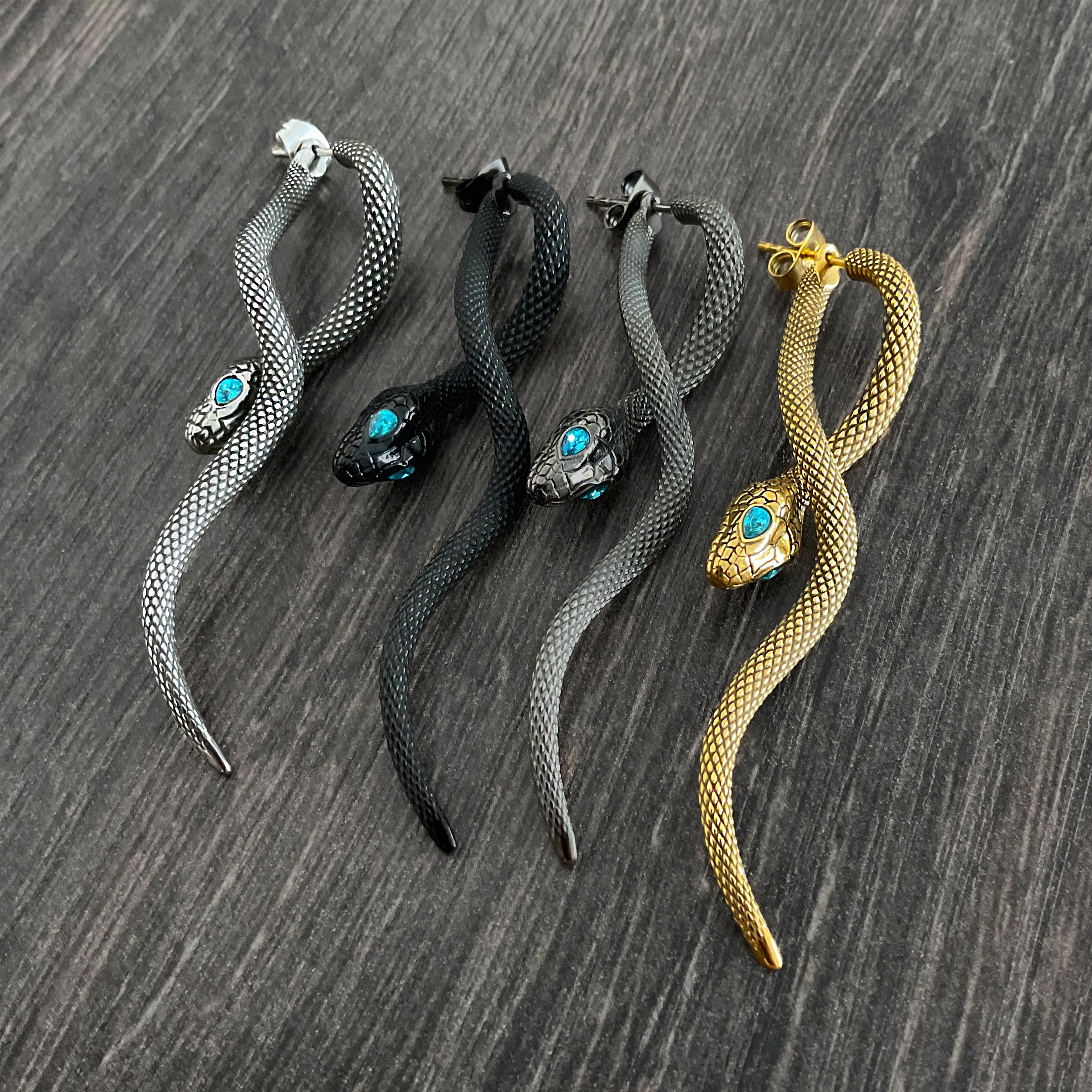 Snake front back earrings with aquamarine eyes