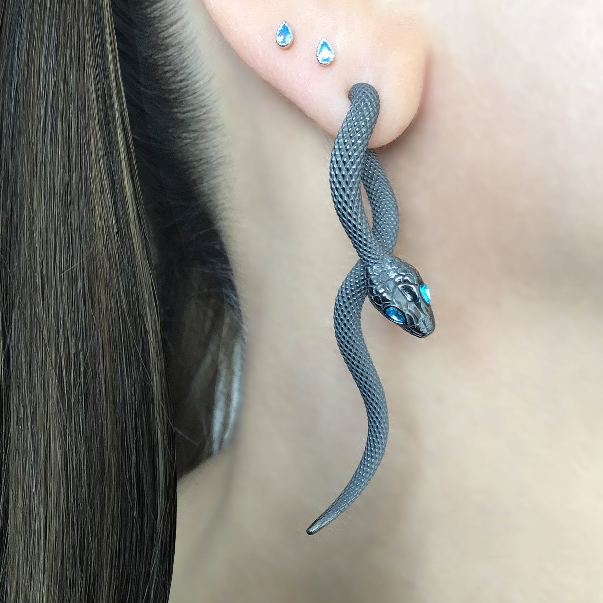 Snake front back earrings with aquamarine eyes