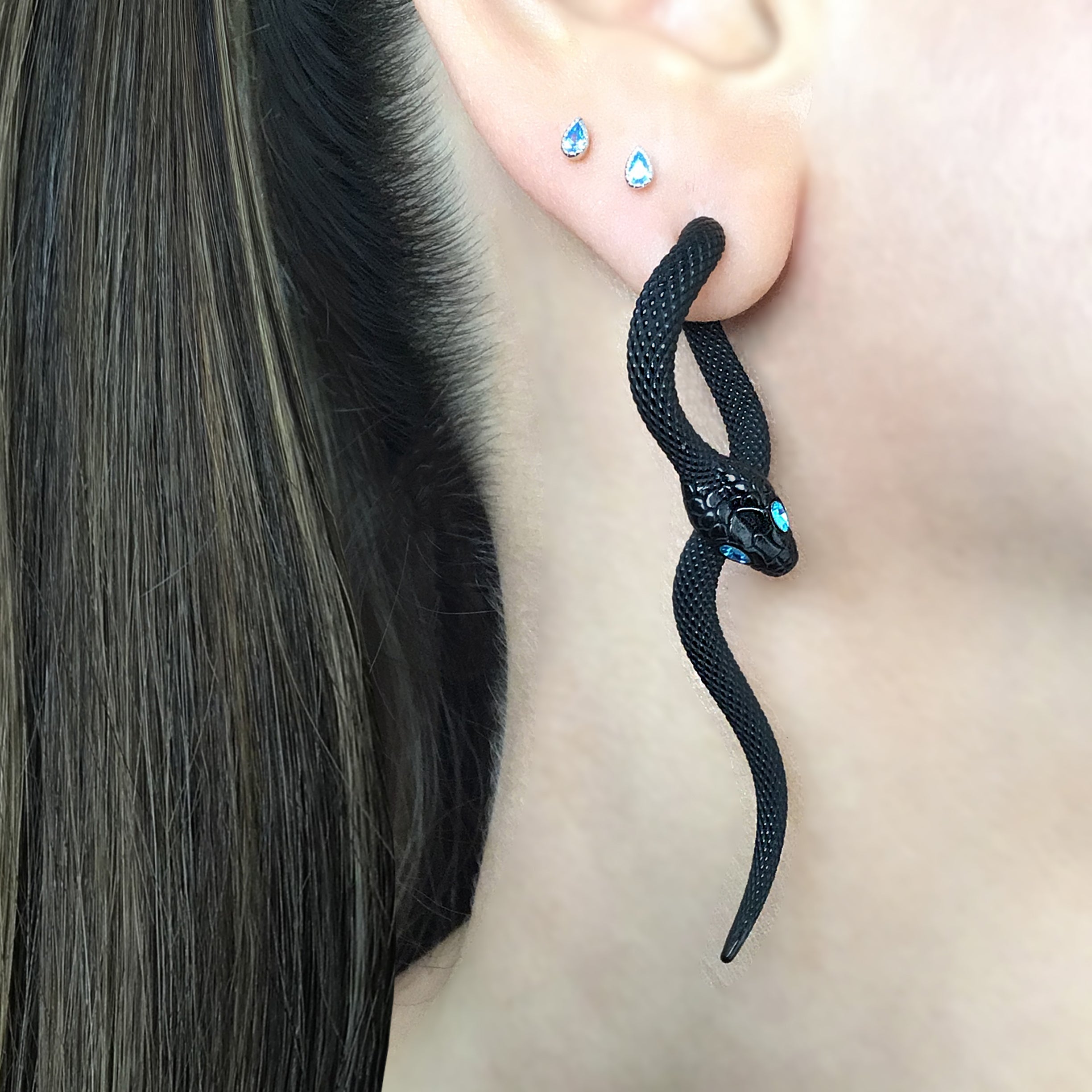 Snake front back earrings with aquamarine eyes