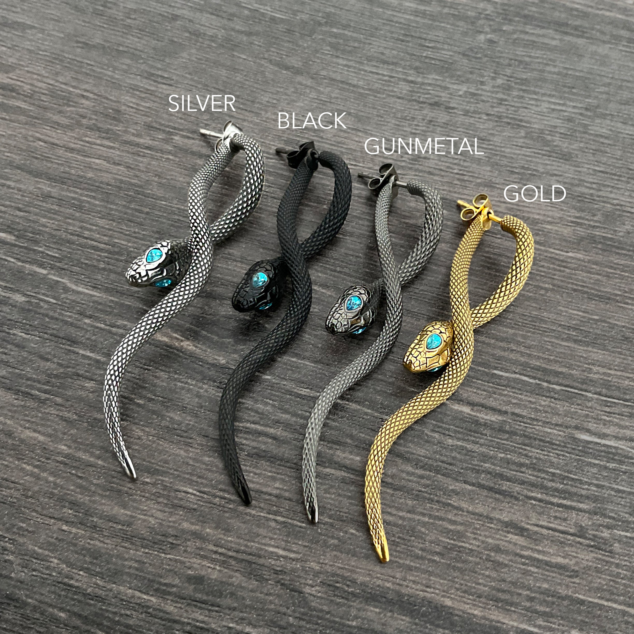 Snake front back earrings with aquamarine eyes