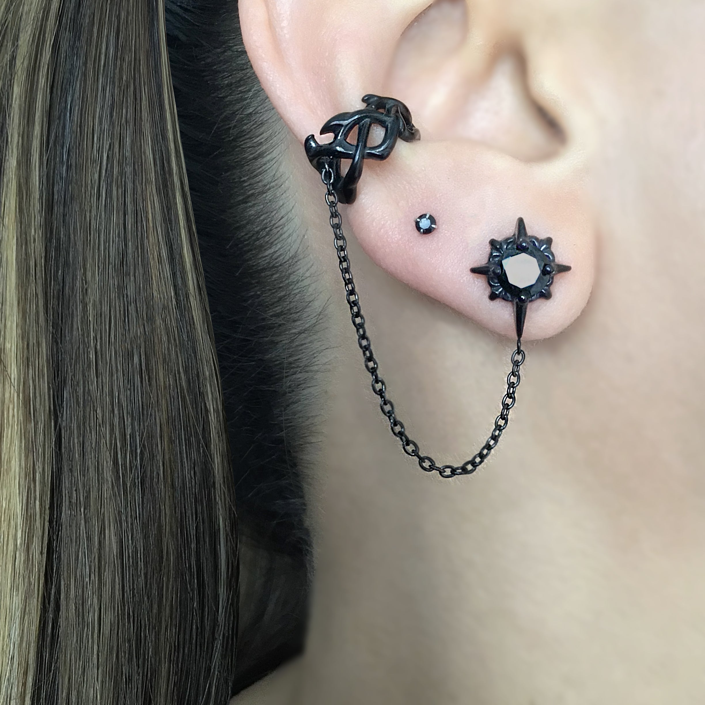Starburst earring with ear cuff attached in Black