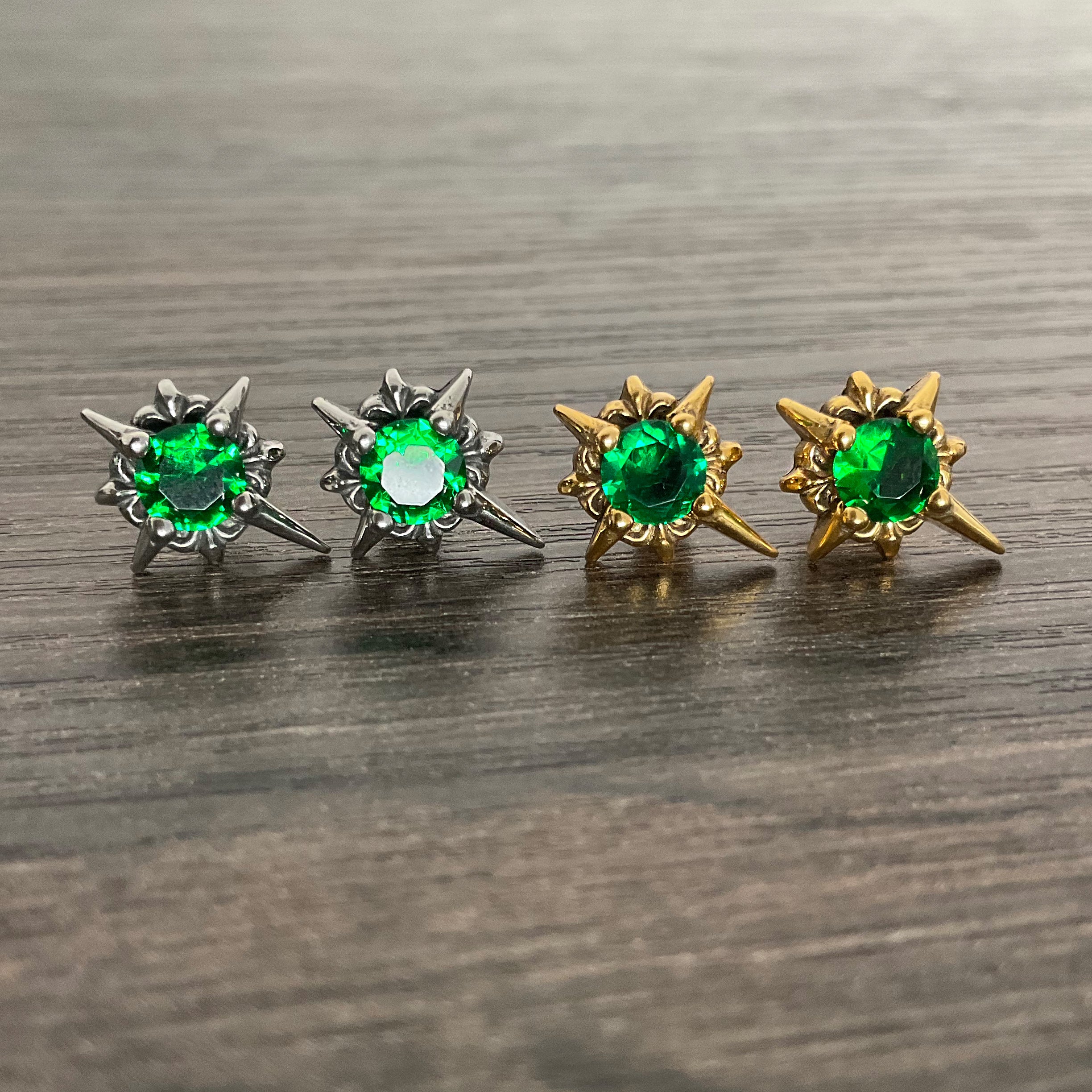 Starburst stud earrings with Green CZ