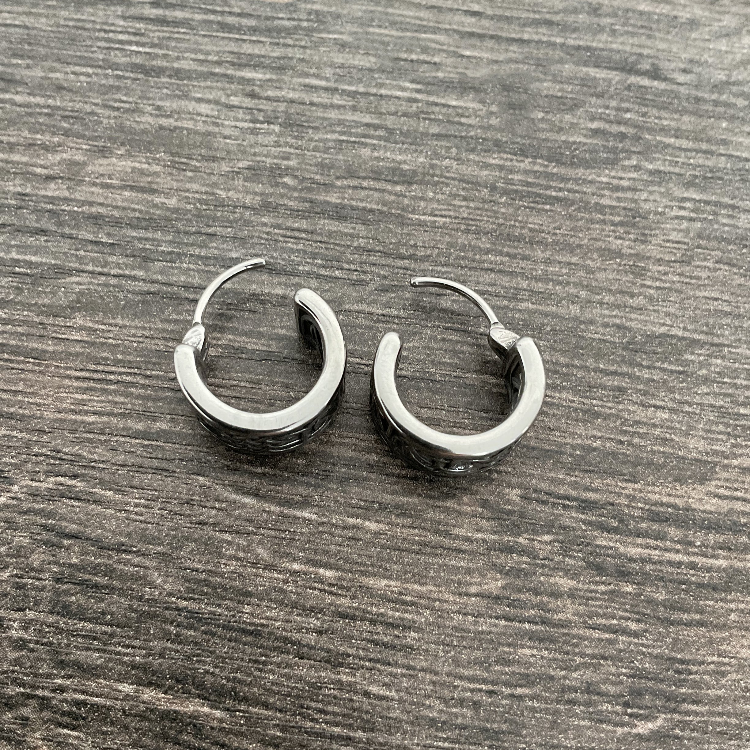 Wide Celtic hoop earrings in Black