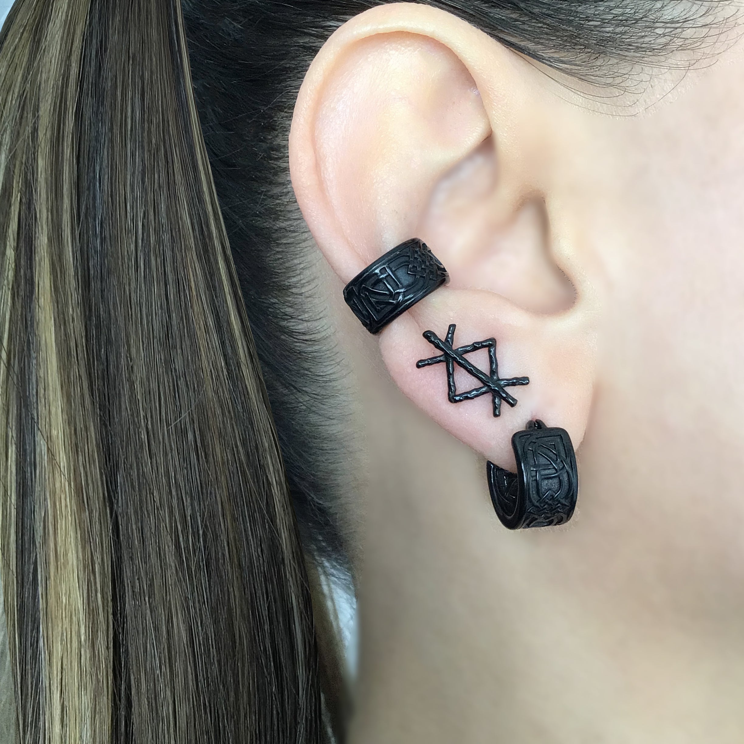 Wide Celtic hoop earrings in Black