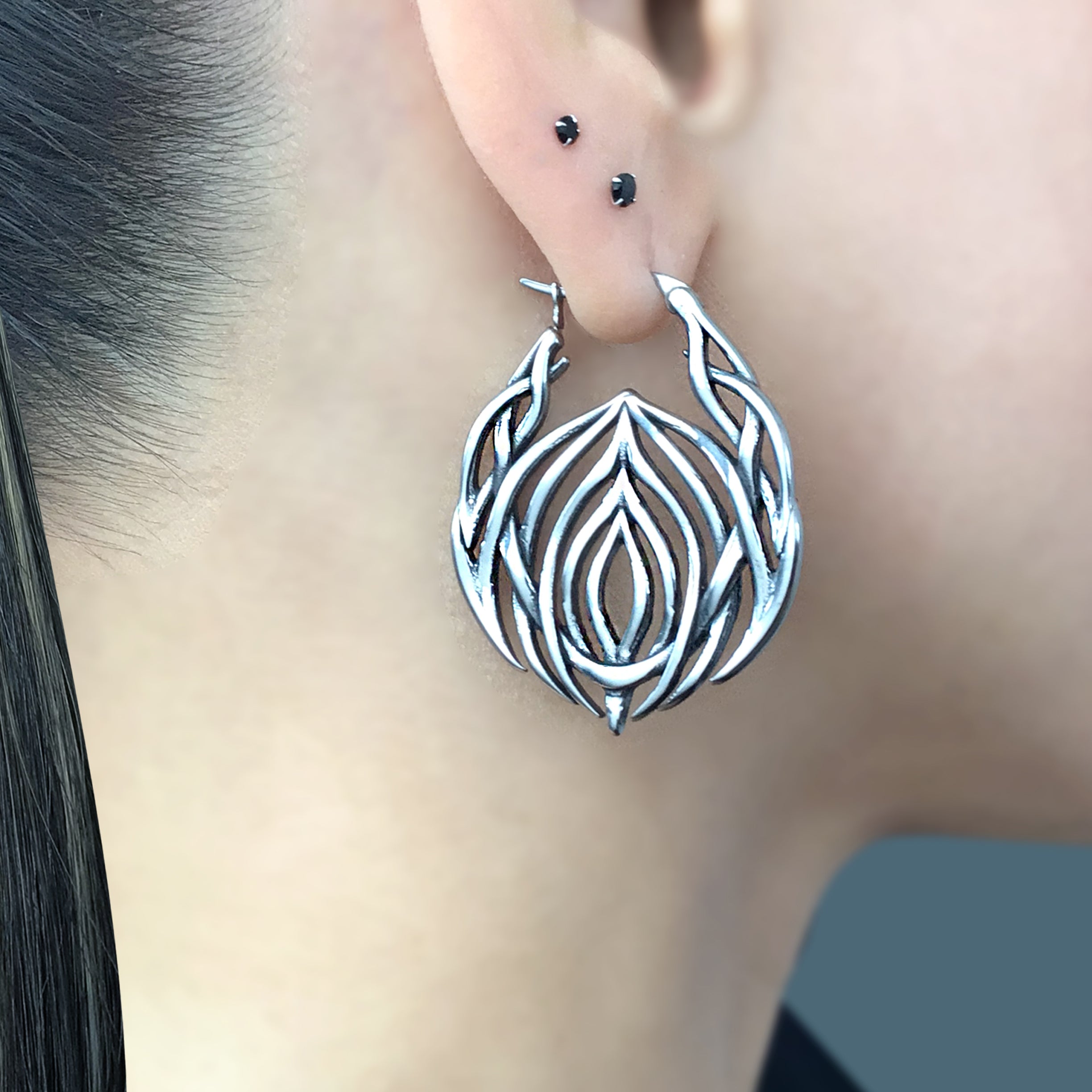 Tribal cyber hoop earrings in Black