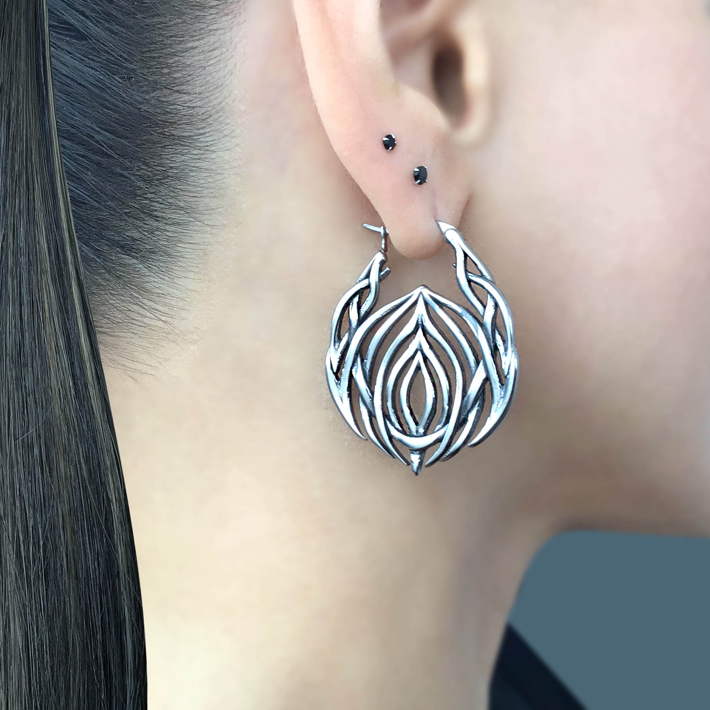 Tribal cyber hoop earrings in Black