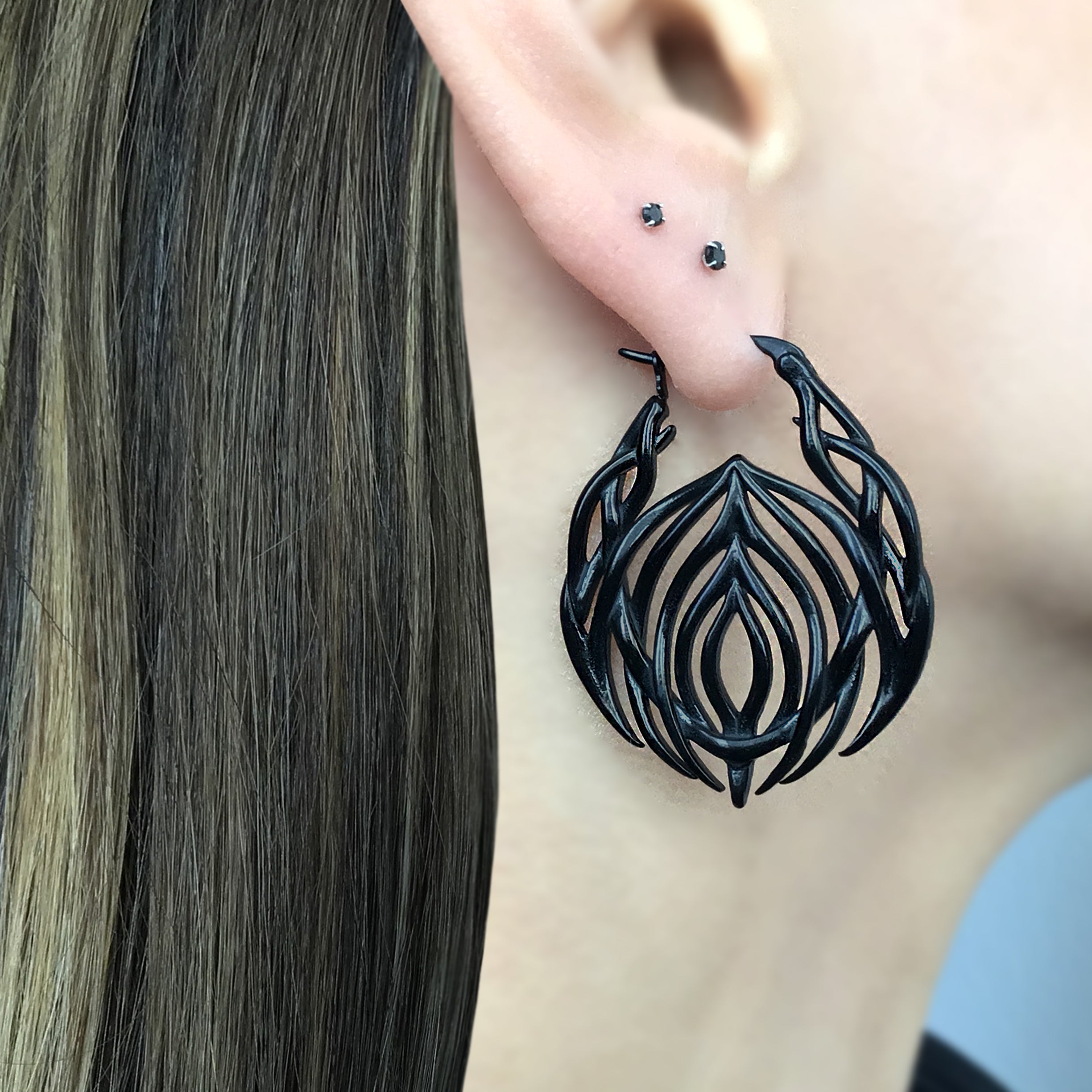 Tribal cyber hoop earrings in Black