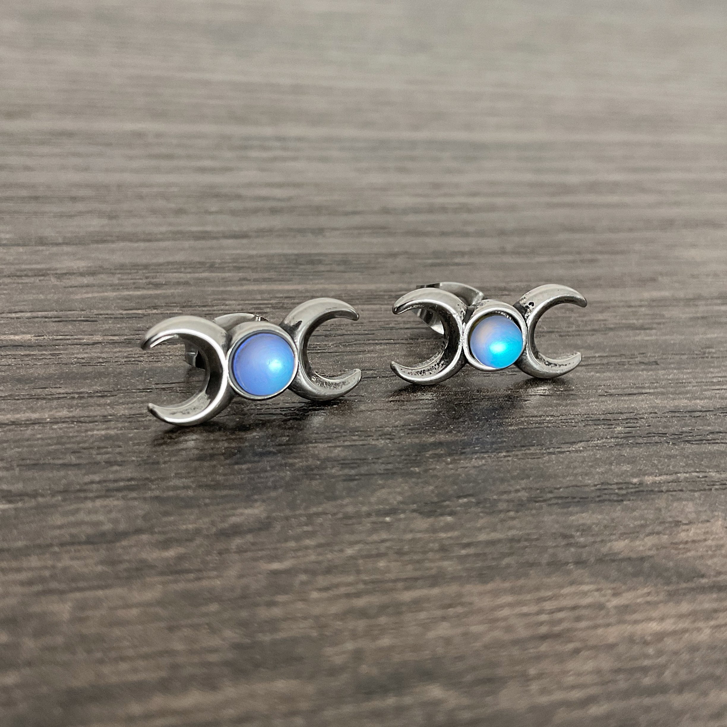 Two moons stud earrings with Blue stone