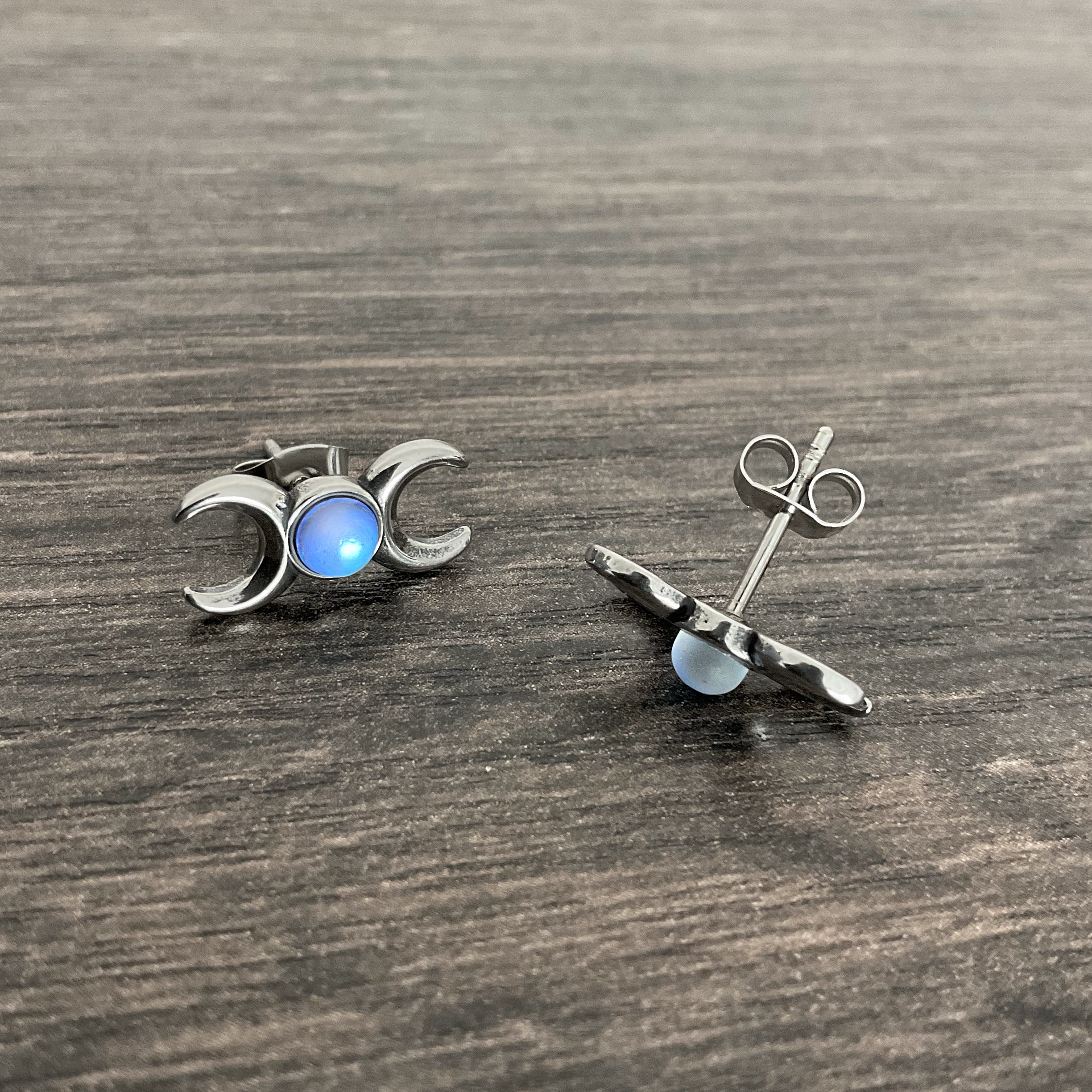 Two moons stud earrings with Blue stone