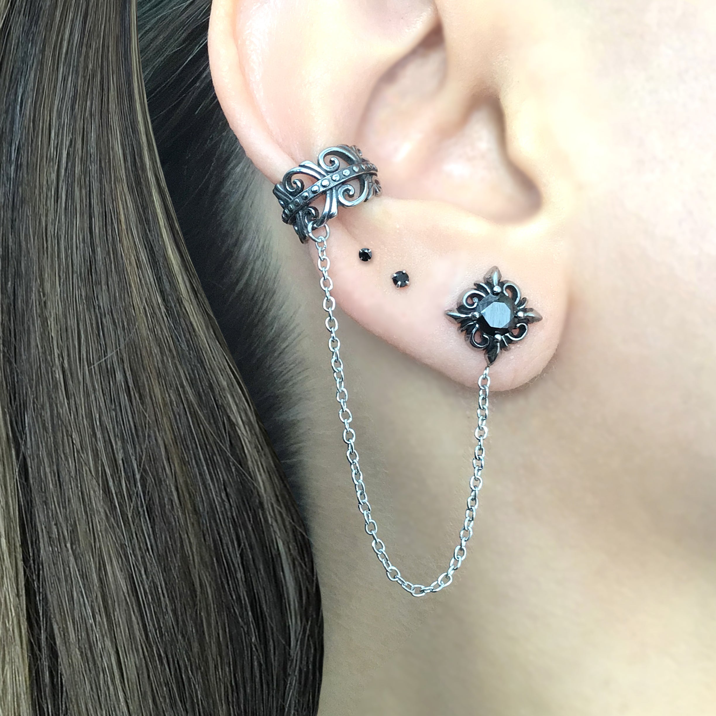 Stud earring with ear cuff attached