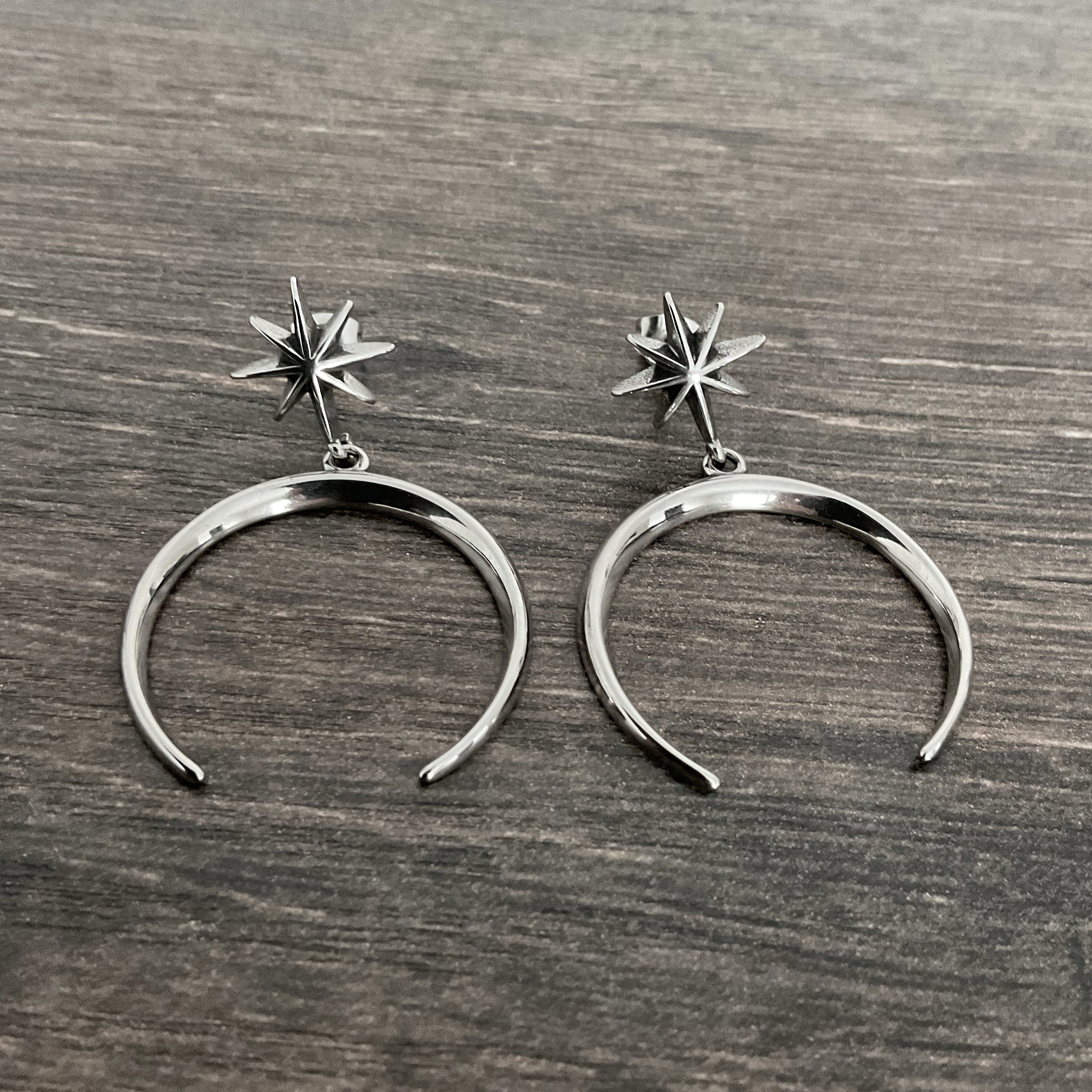 Star and moon stud earrings in Black