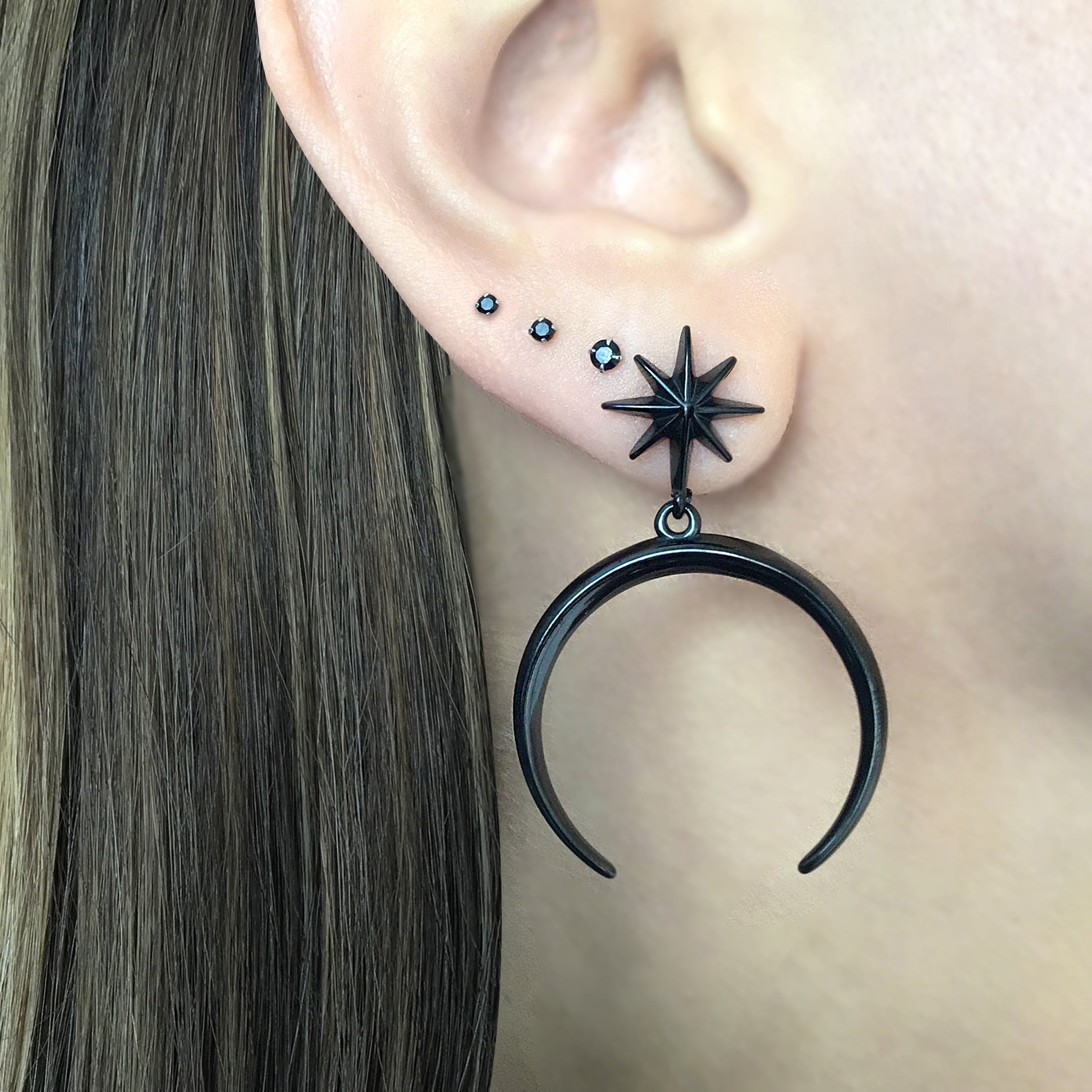 Star and moon stud earrings in Black