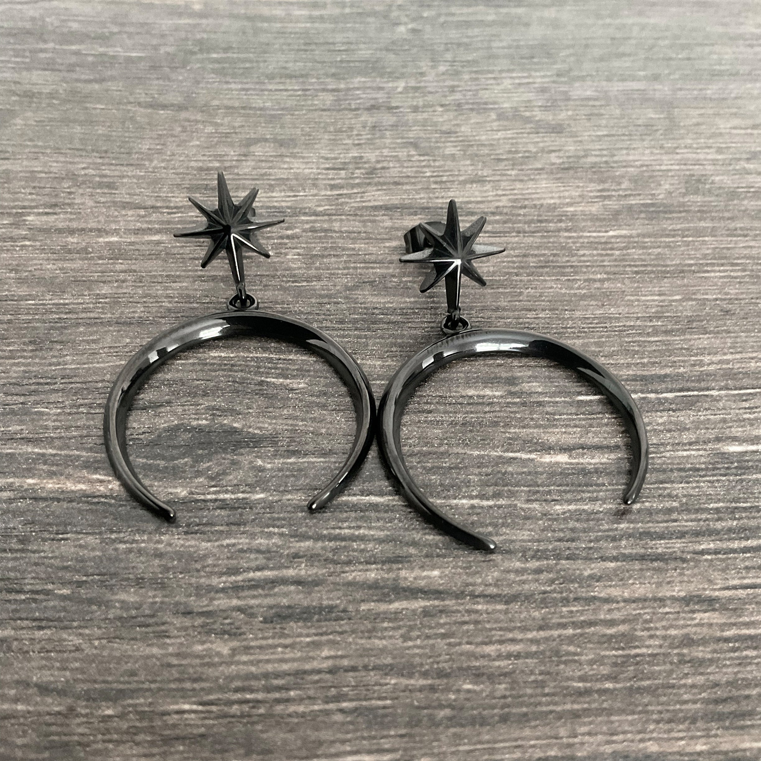 Star and moon stud earrings in Black