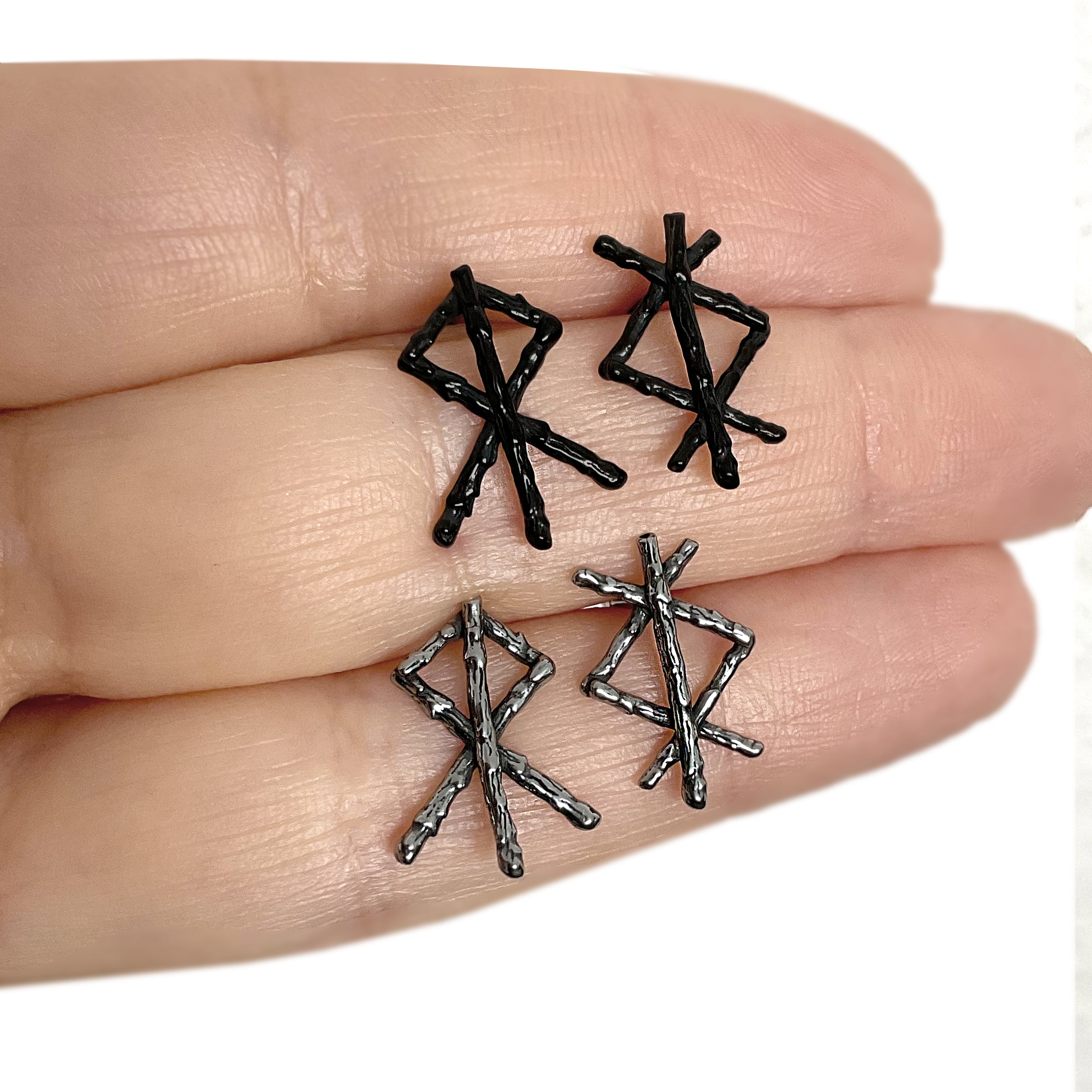 Mismatched Rune stud earrings in Black