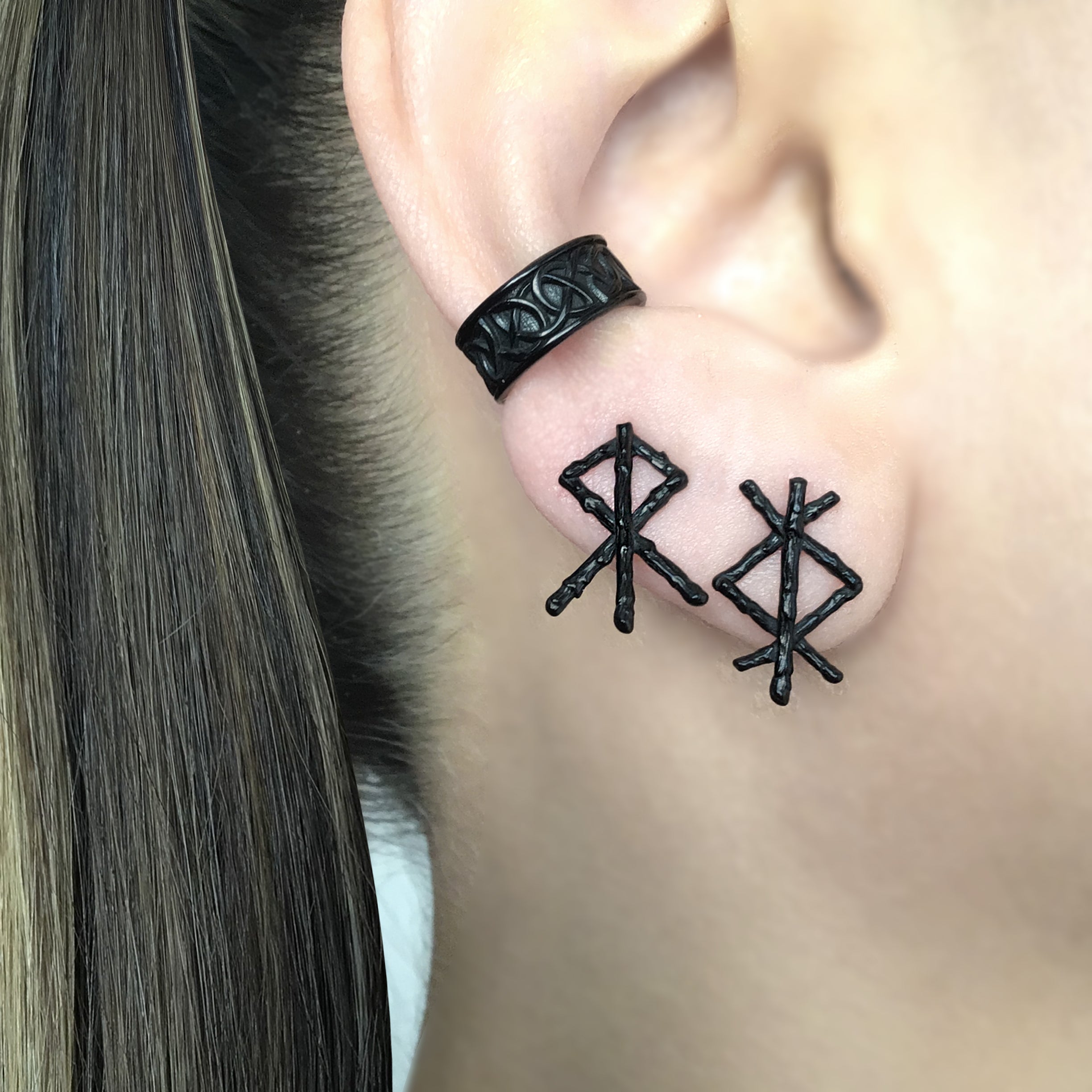 Mismatched Rune stud earrings in Black