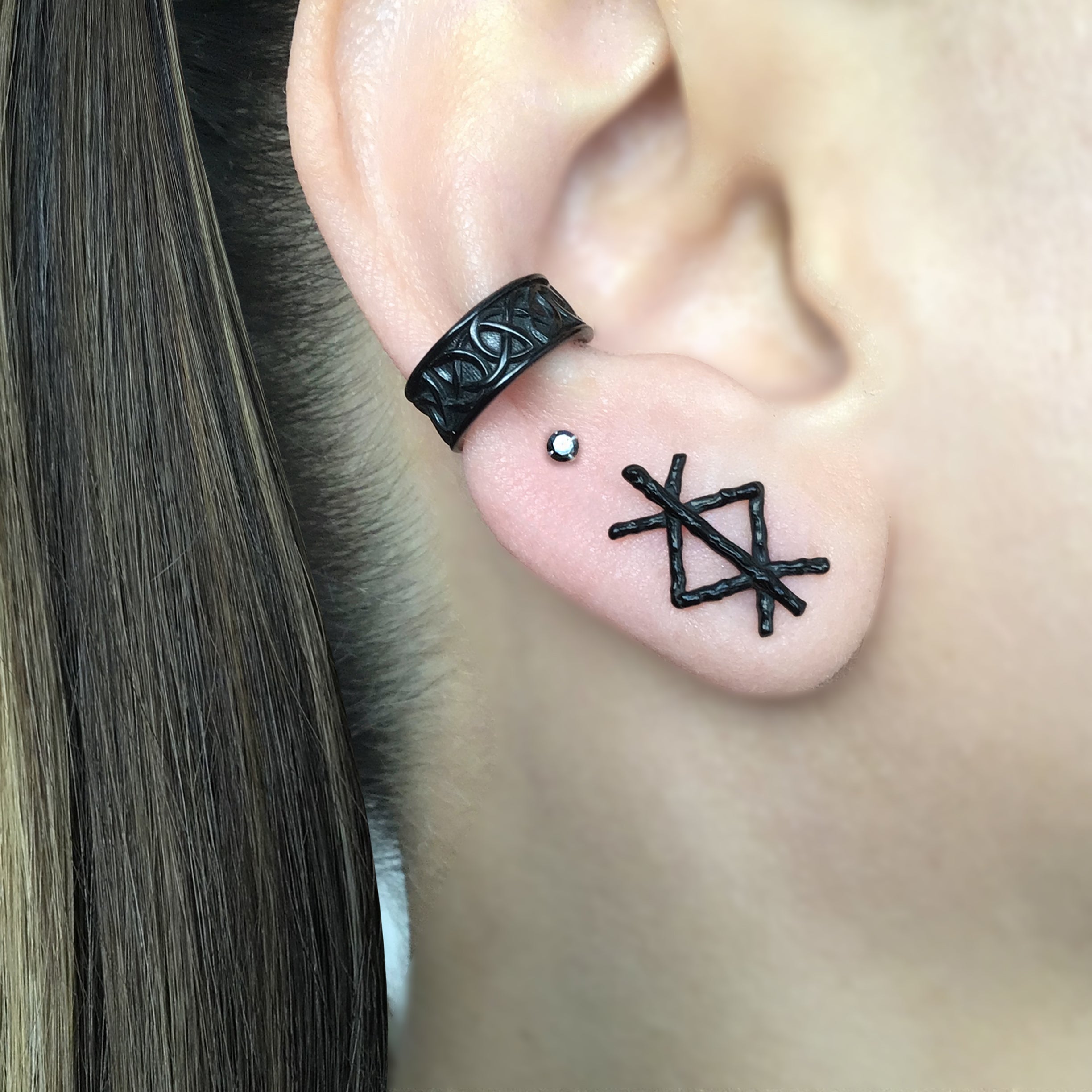 Mismatched Rune stud earrings in Black