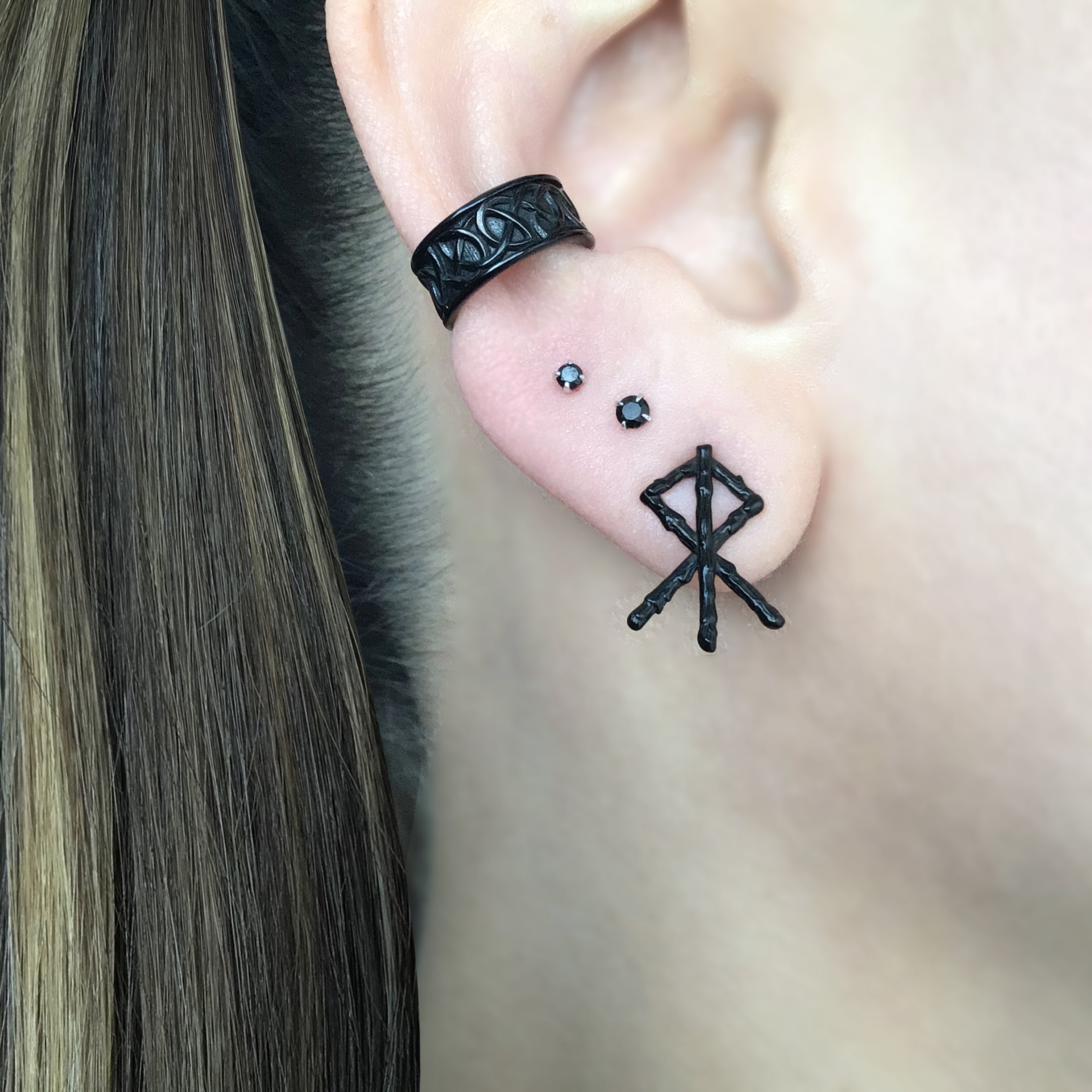 Mismatched Rune stud earrings in Black