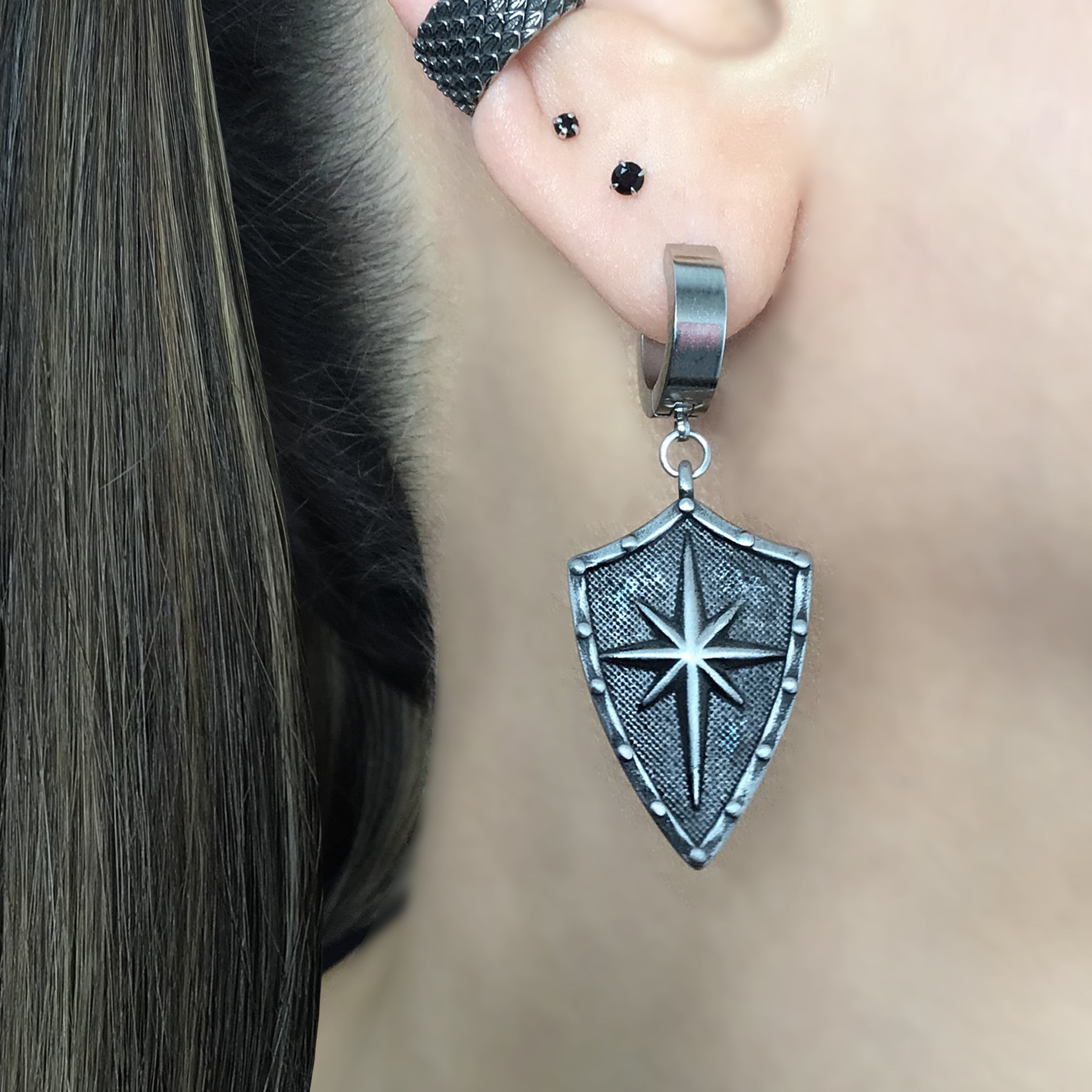 Shield with North Star hoop earring