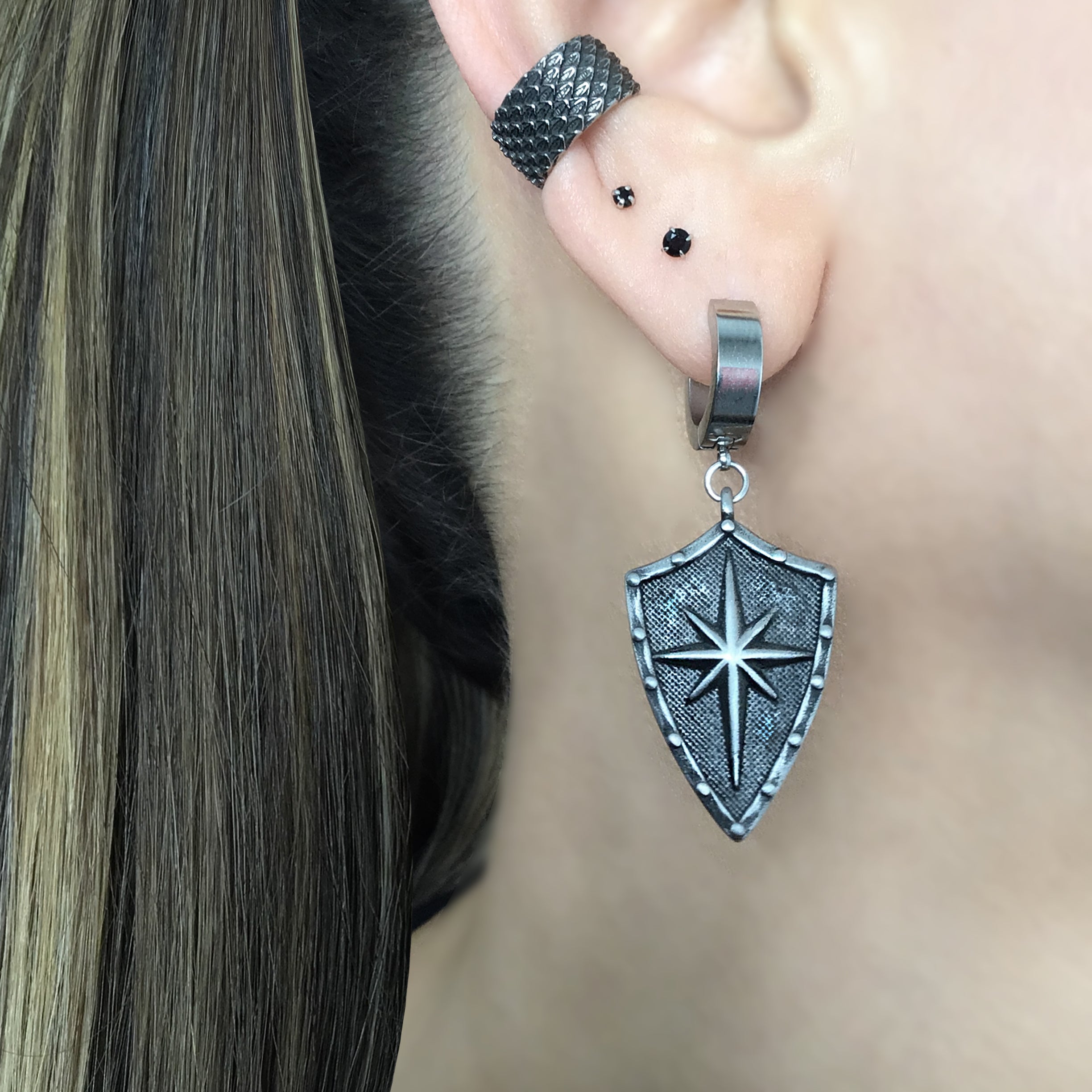 Shield with North Star hoop earring