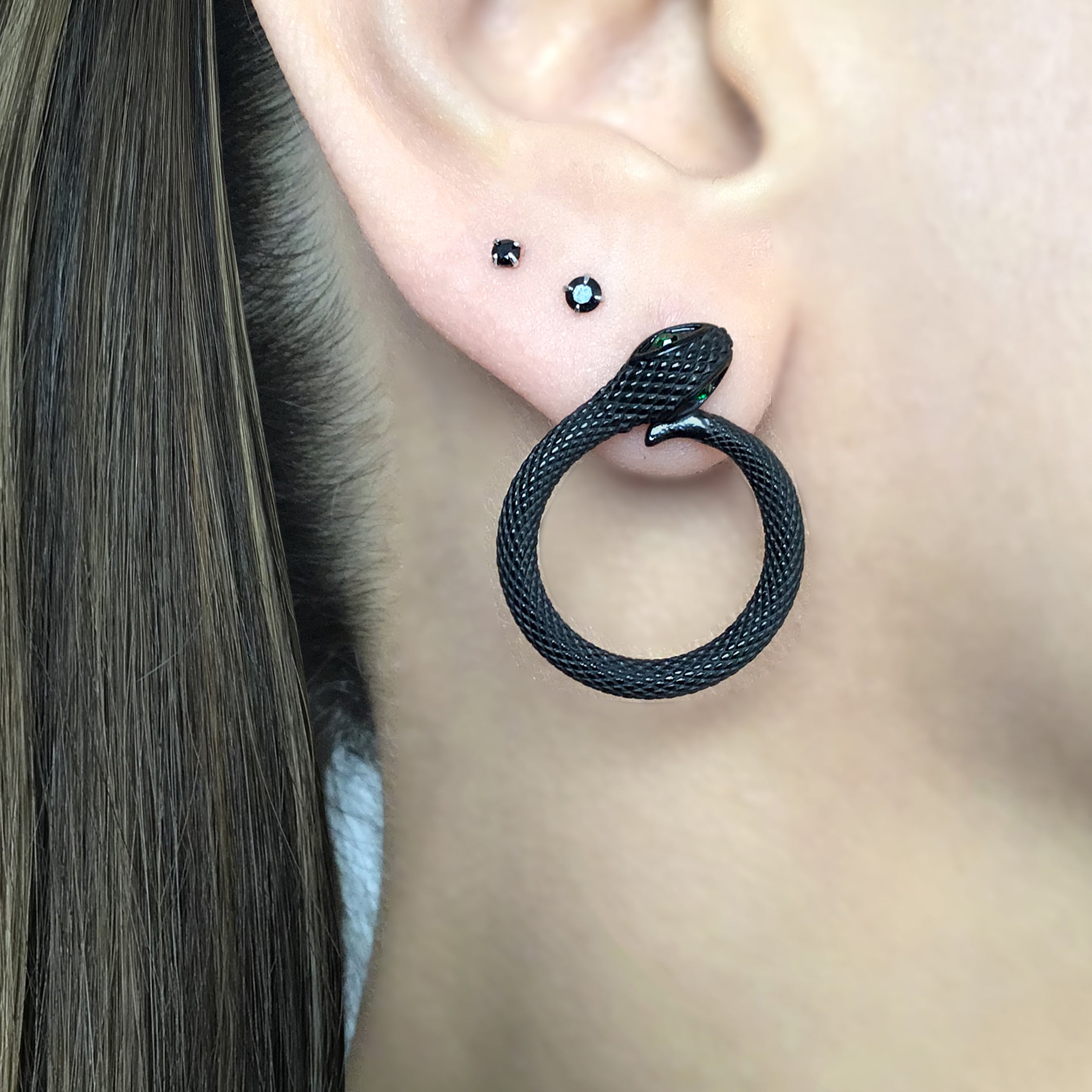 Snake stud earrings with Emerald CZ stones