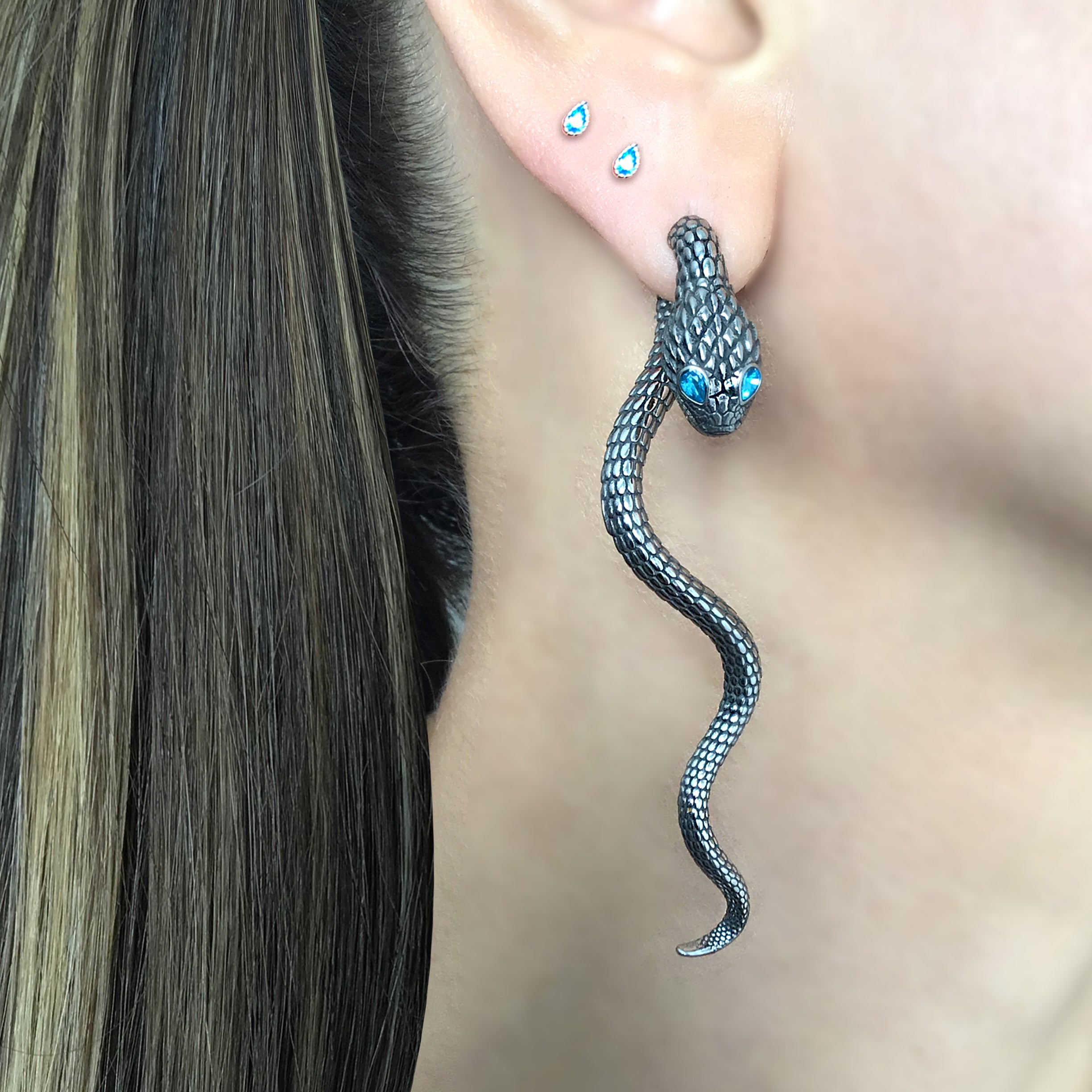 Snake ear jacket with aquamarine eyes