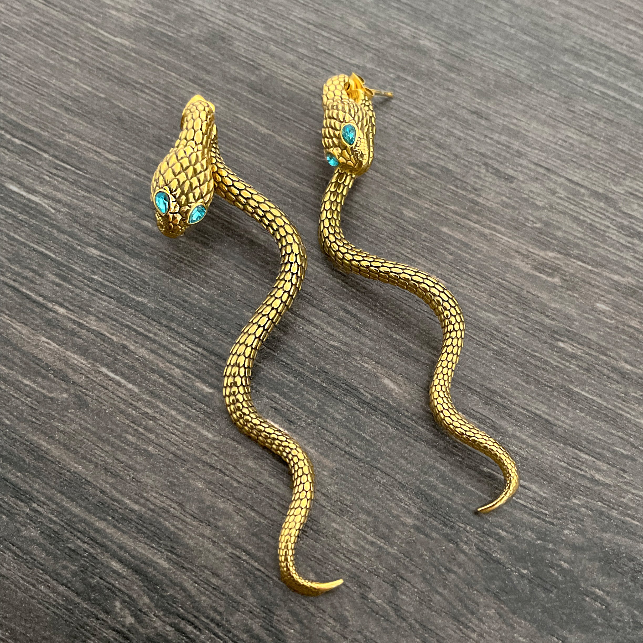 Snake ear jacket with aquamarine eyes