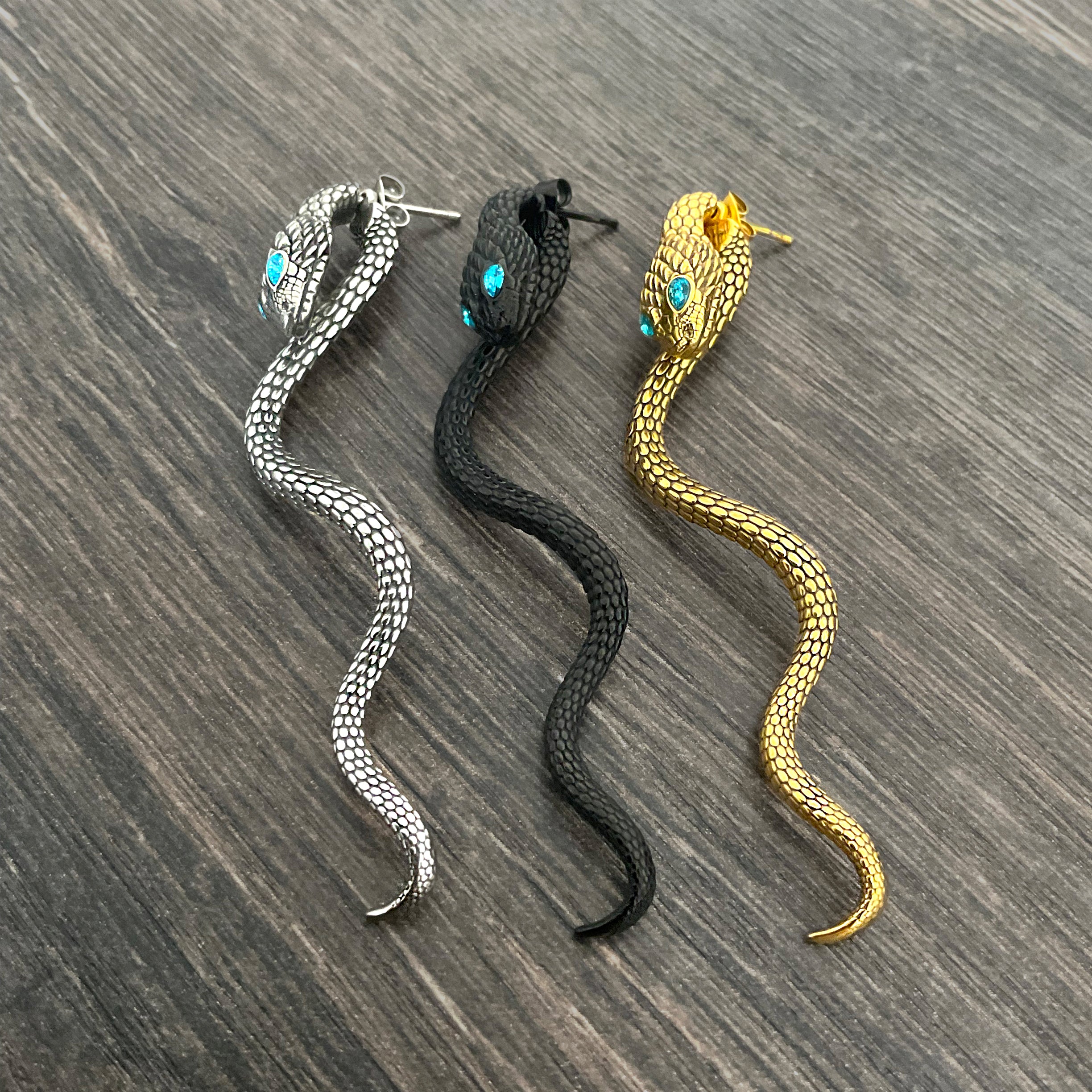 Snake ear jacket with aquamarine eyes