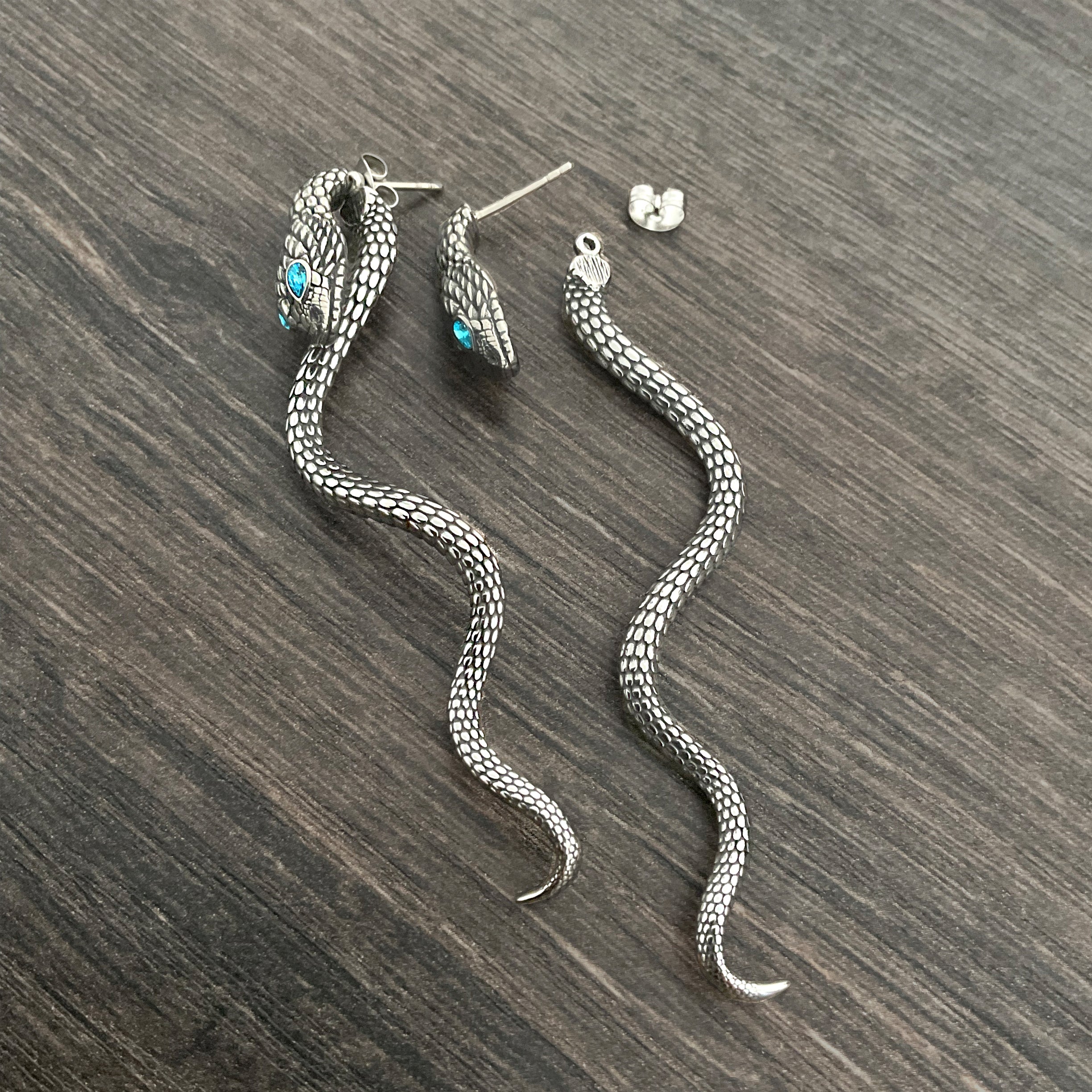 Snake ear jacket with aquamarine eyes