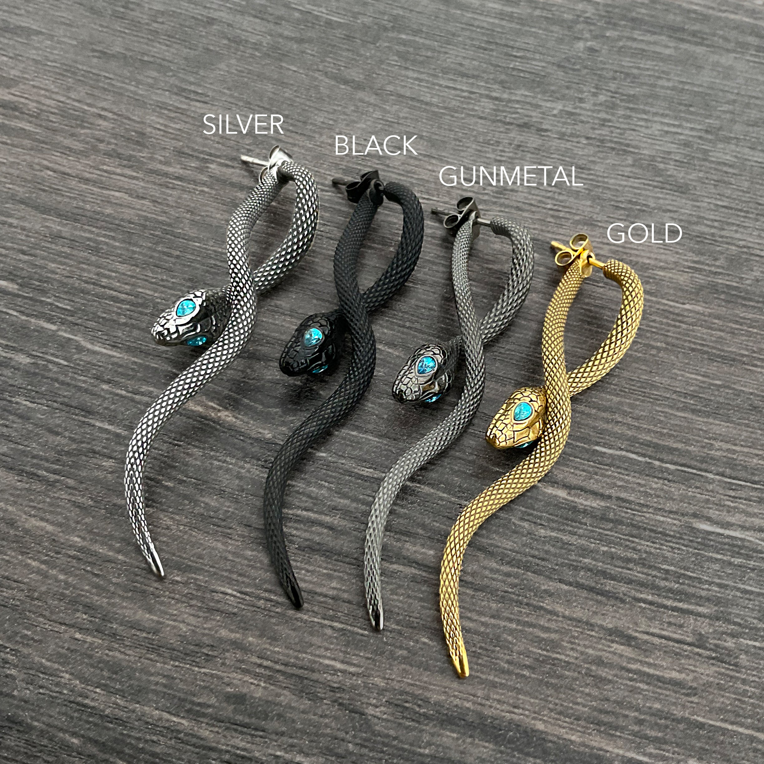 Snake front back earrings with aquamarine eyes in Black