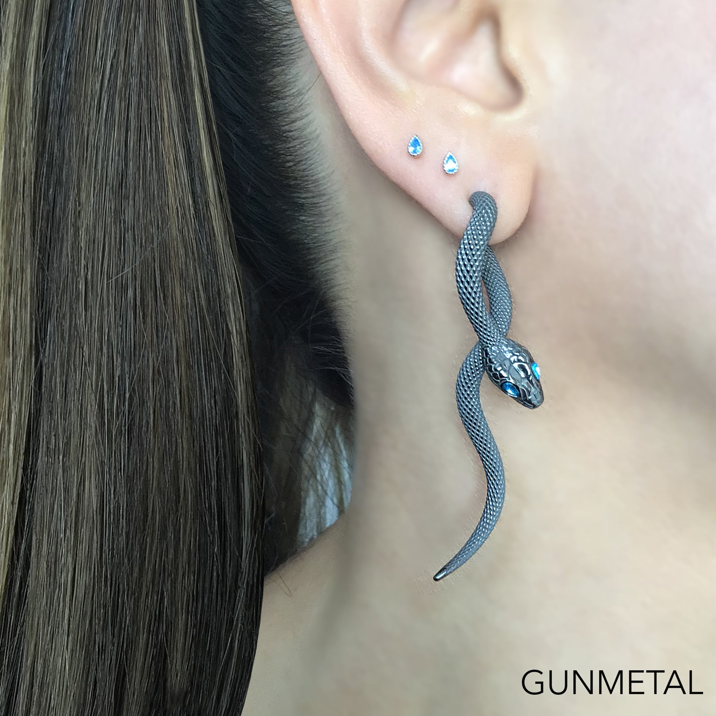 Snake front back earrings with aquamarine eyes in Black